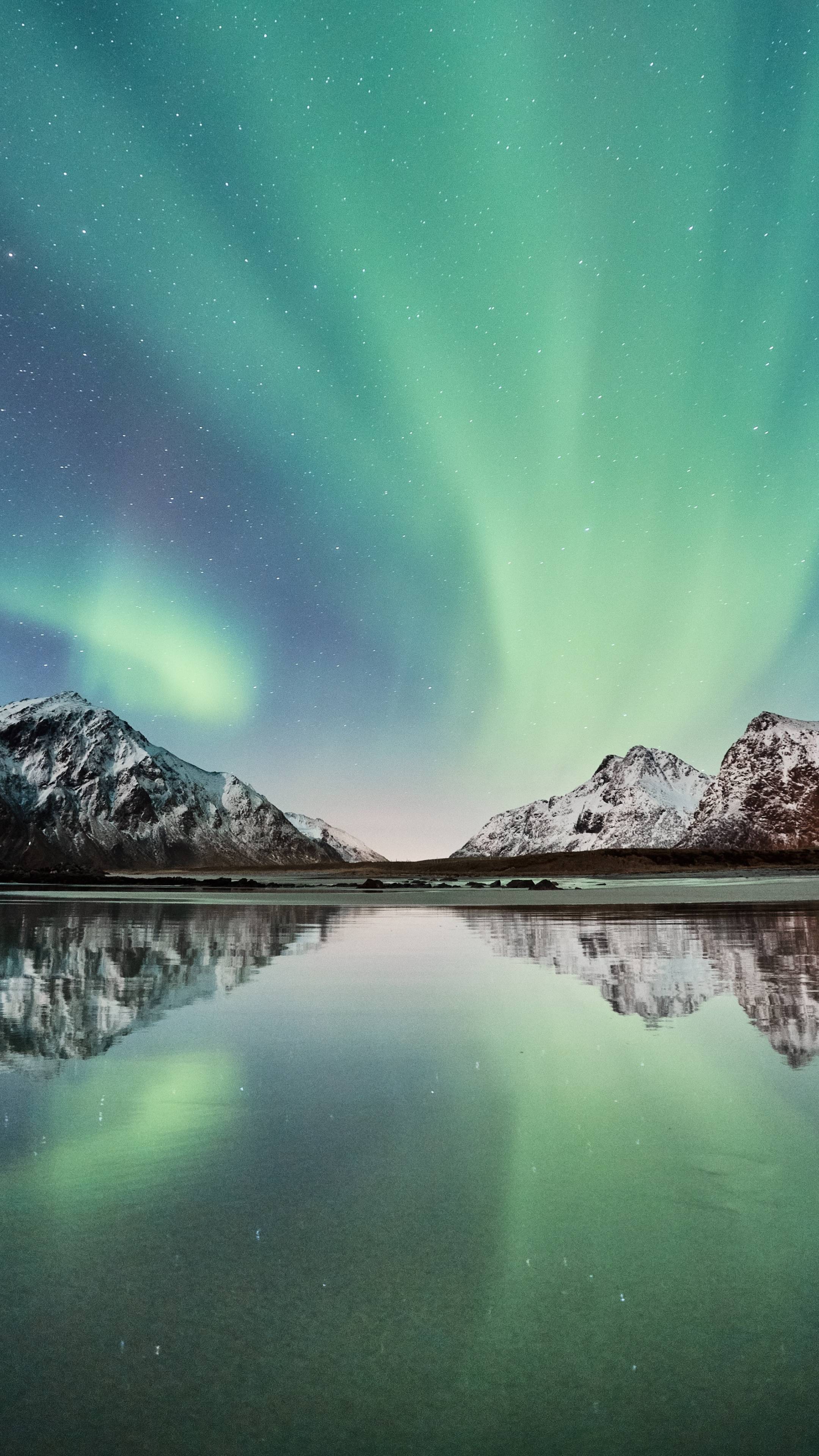 Download 2160x3840 wallpaper northern lights, snow mountains