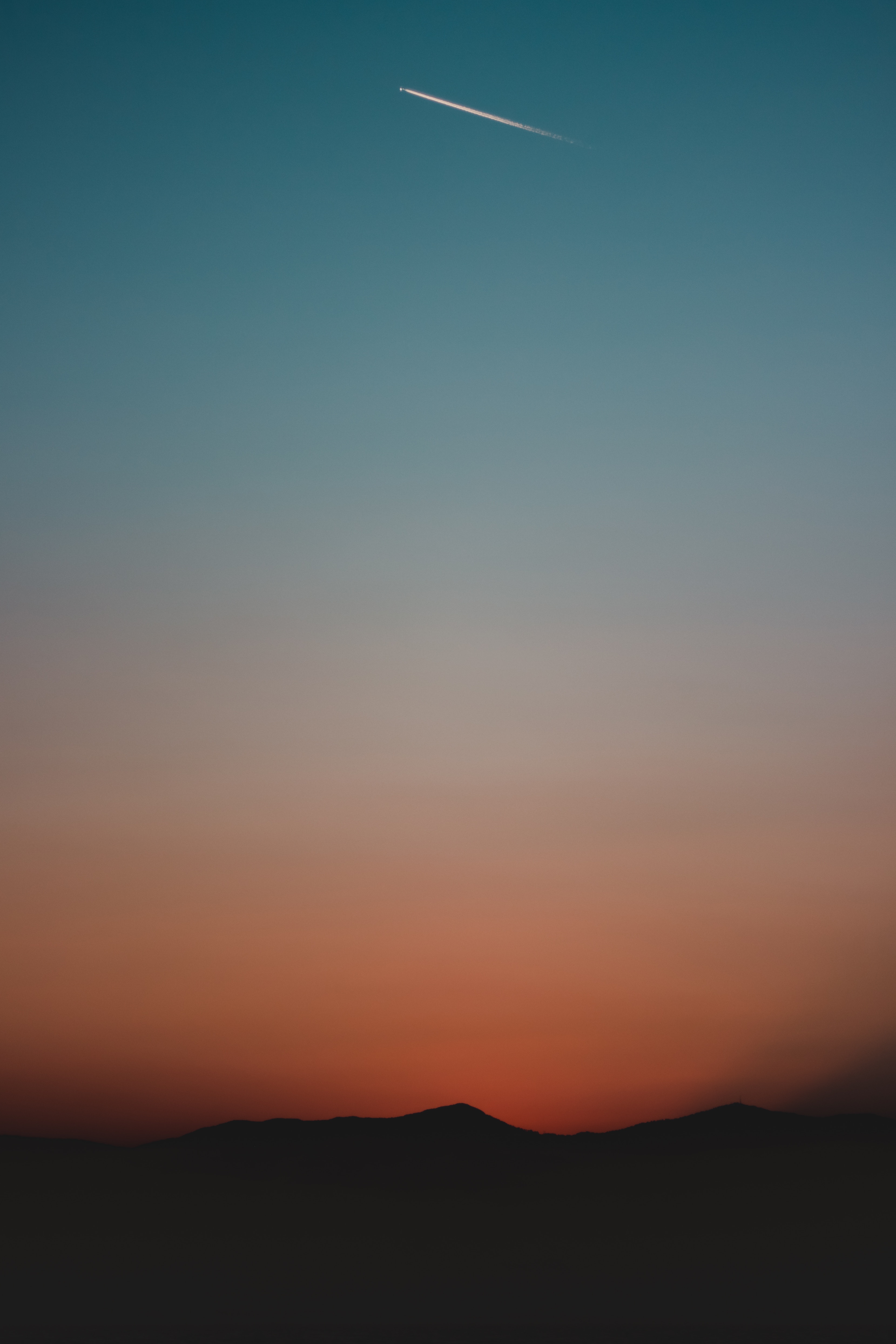 Download wallpaper 3318x4977 mountains, sky, gradient, dark, sunset