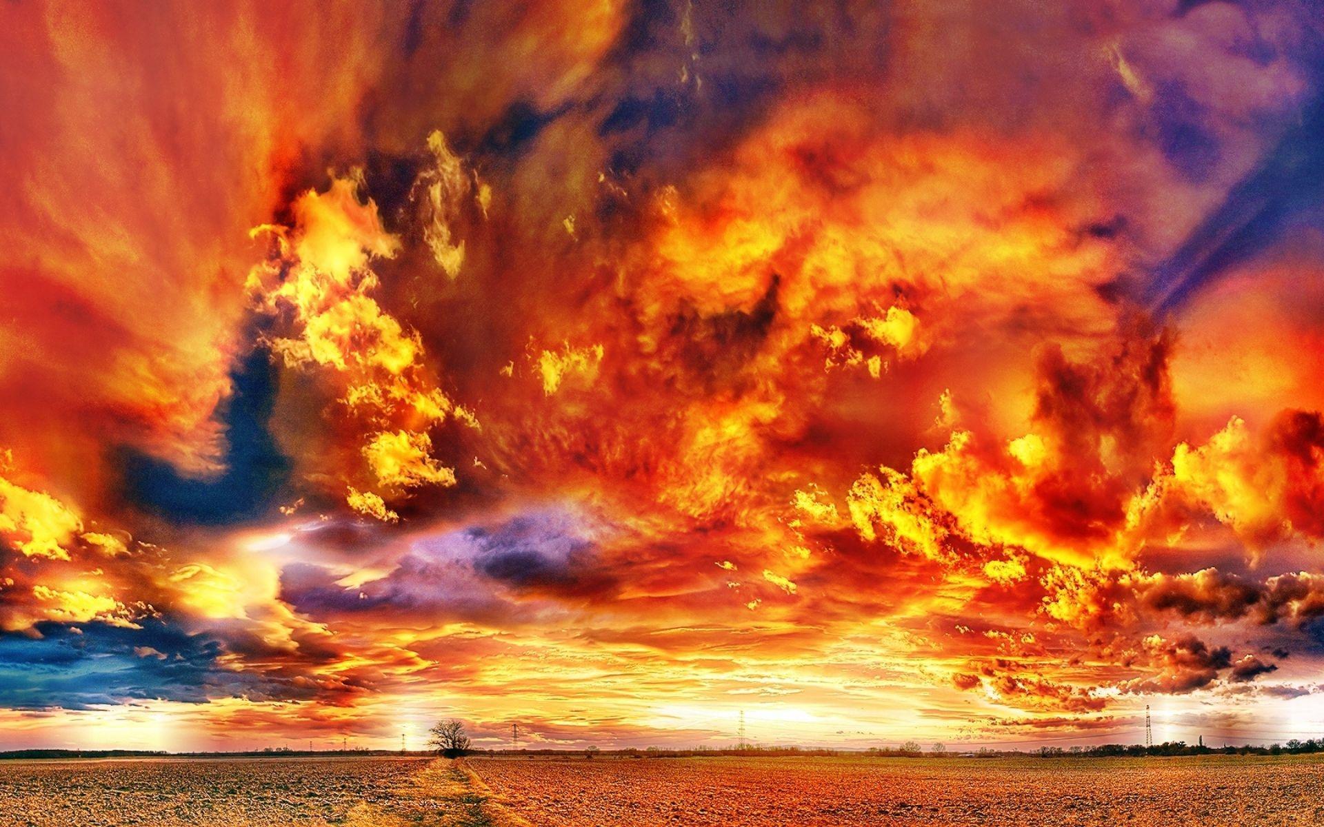 Fiery Clouds Over A Sunset Field wallpaper. nature and landscape