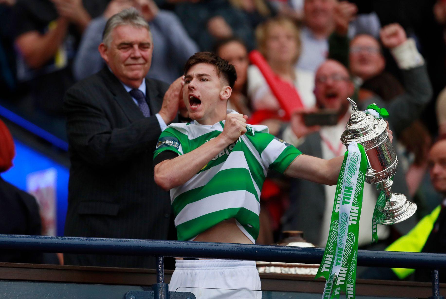 Celtic's Kieran Tierney lifts the Scottish Cup trophy. Football