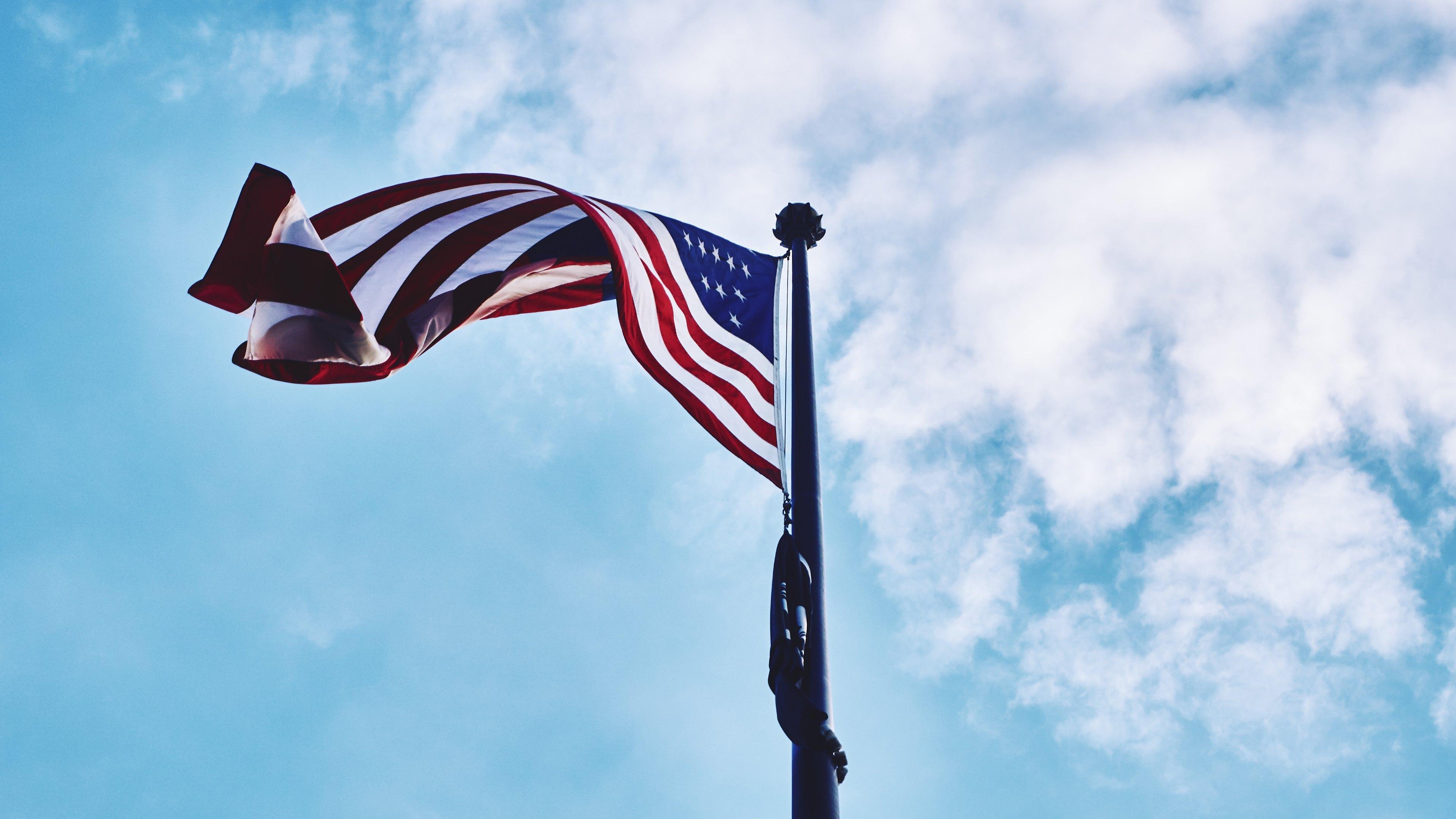 American Flag On Top Of A Flagpole 4k Ultra HD Wallpaper