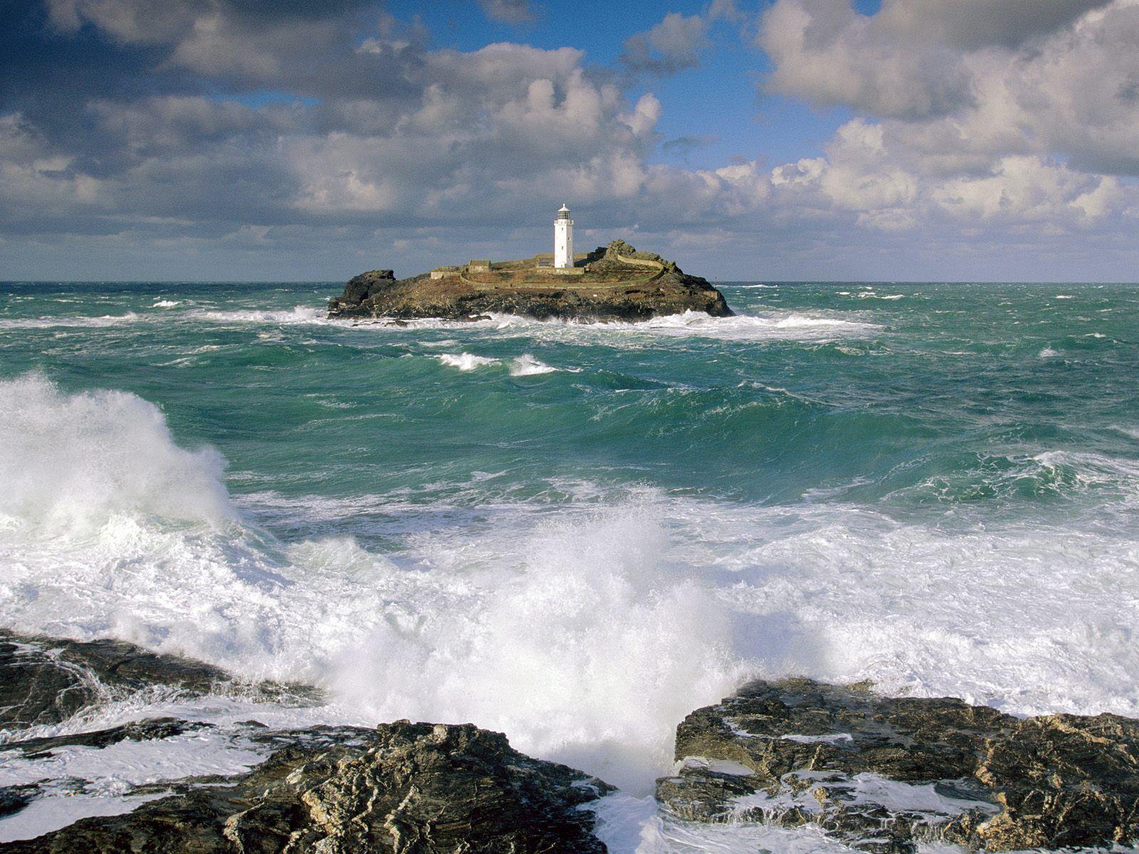 Lighthouse Photography. lighthouse and rough seas cornwall england