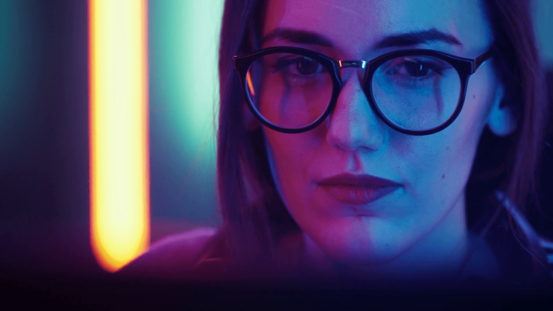 Portrait of the Beautiful Young Girl Sitting Before Computer