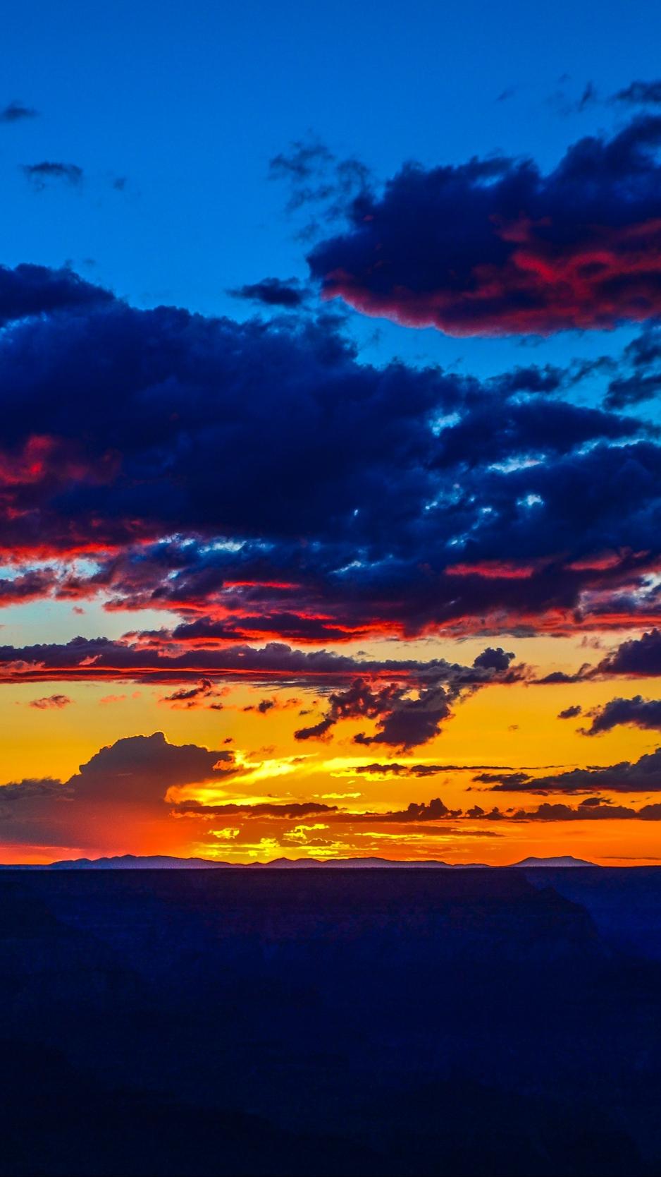 Download wallpaper 938x1668 sunset, horizon, clouds, colorful, sky