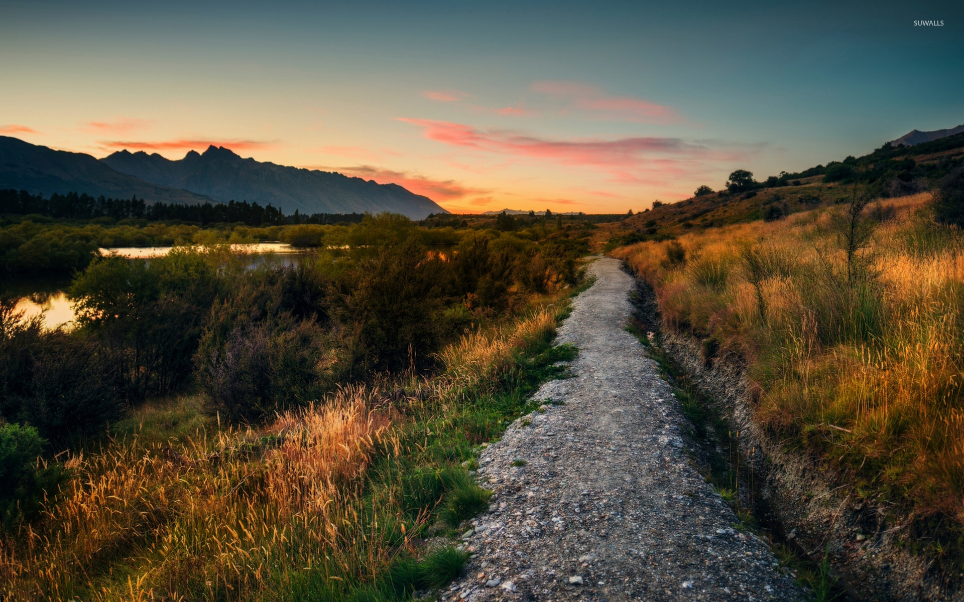 Stone path on the river side towards the sunset wallpaper