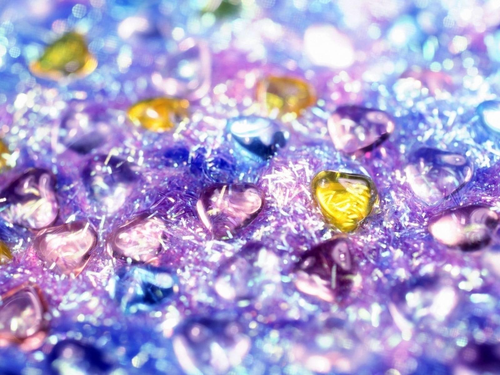 Purple, beige, and blue crystal hearts on purple glitter digital