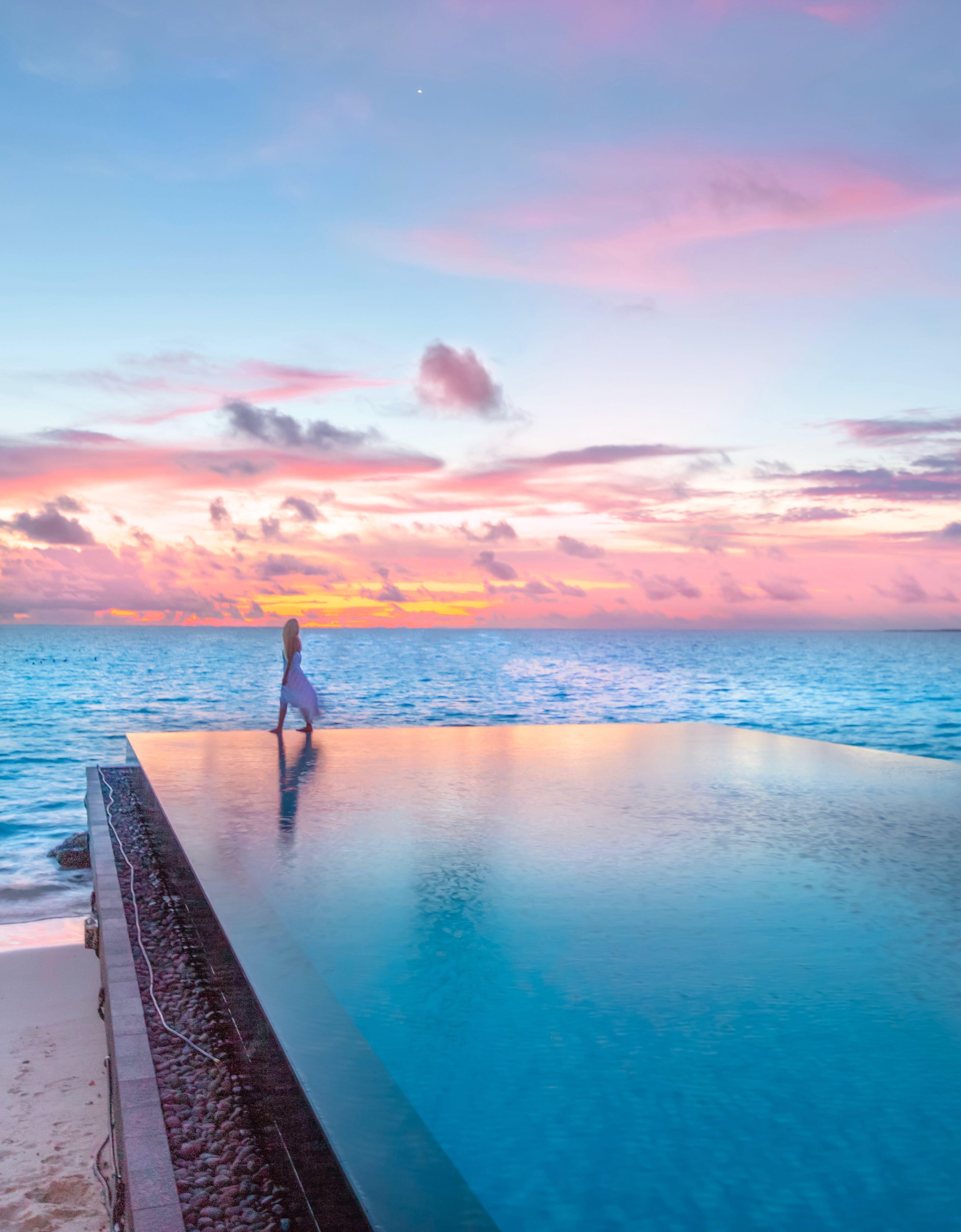 Sunset over the infinity pool at Fairmont Maldives PC Bense