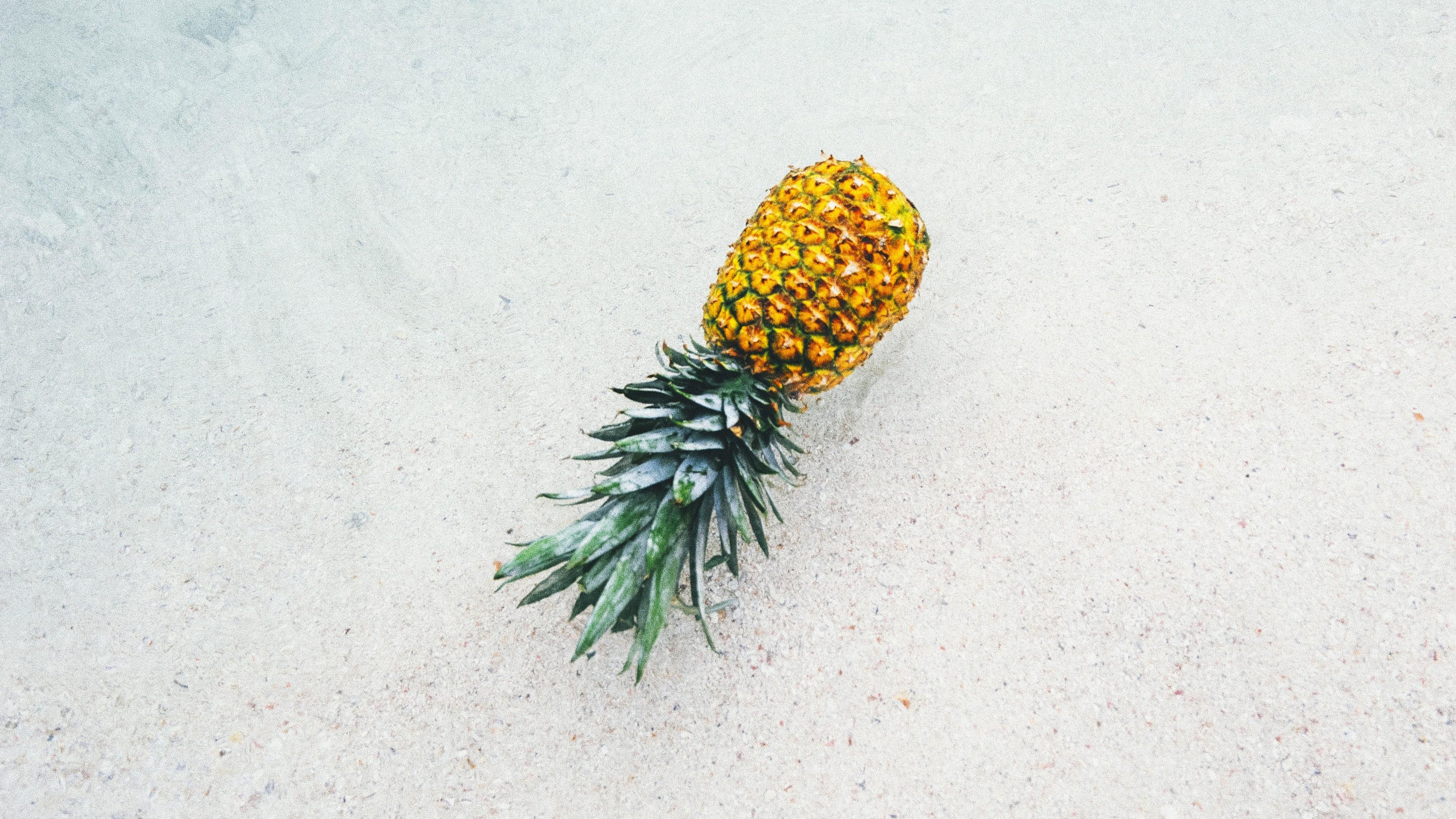 Pineapple on Beach During Summer Season 4K Wallpaper