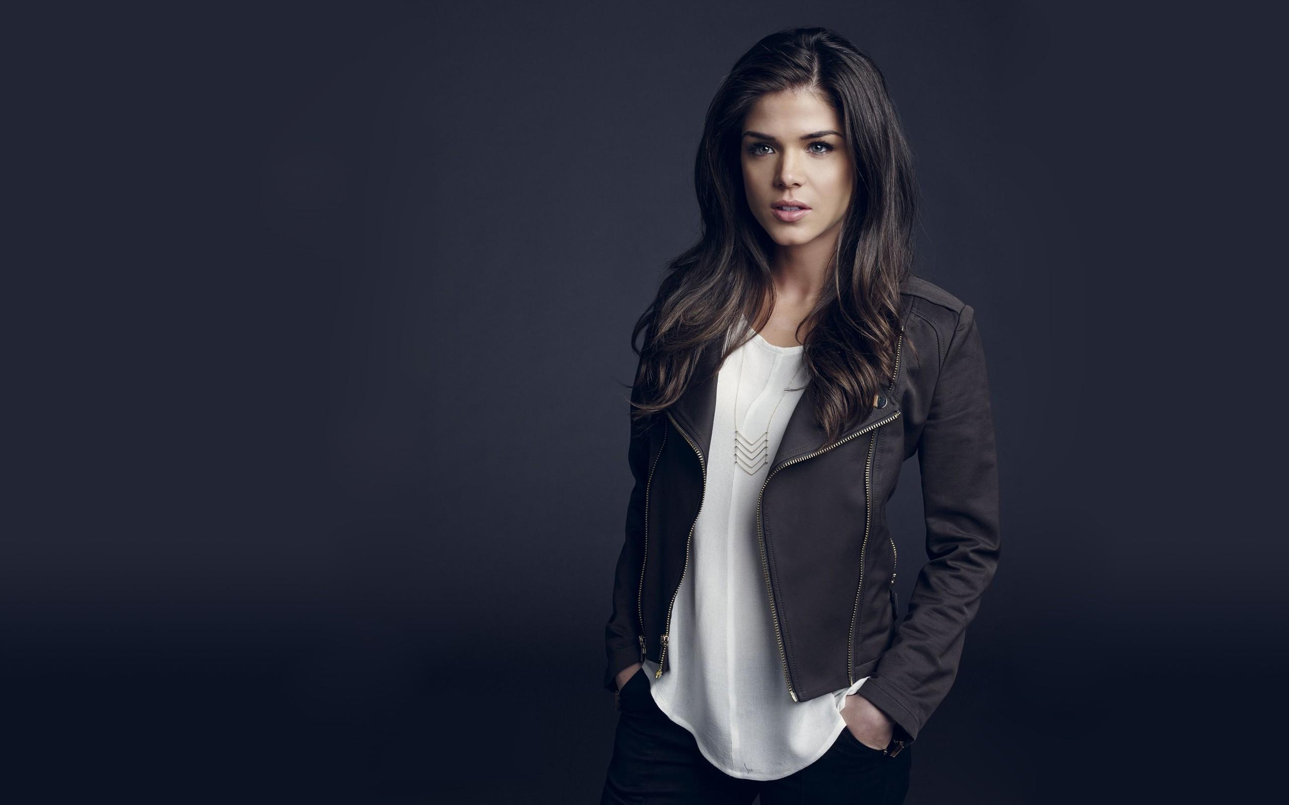 marie avgeropoulos brunette blue background jacket model