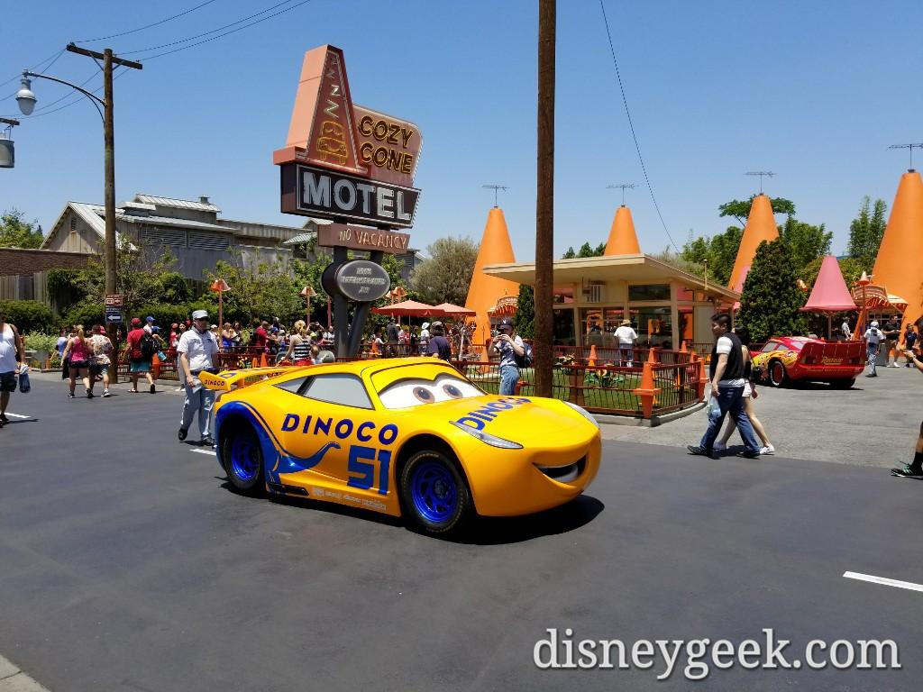 Cruz Ramirez passing the Cozy Cone on Route 66 in Cars Land