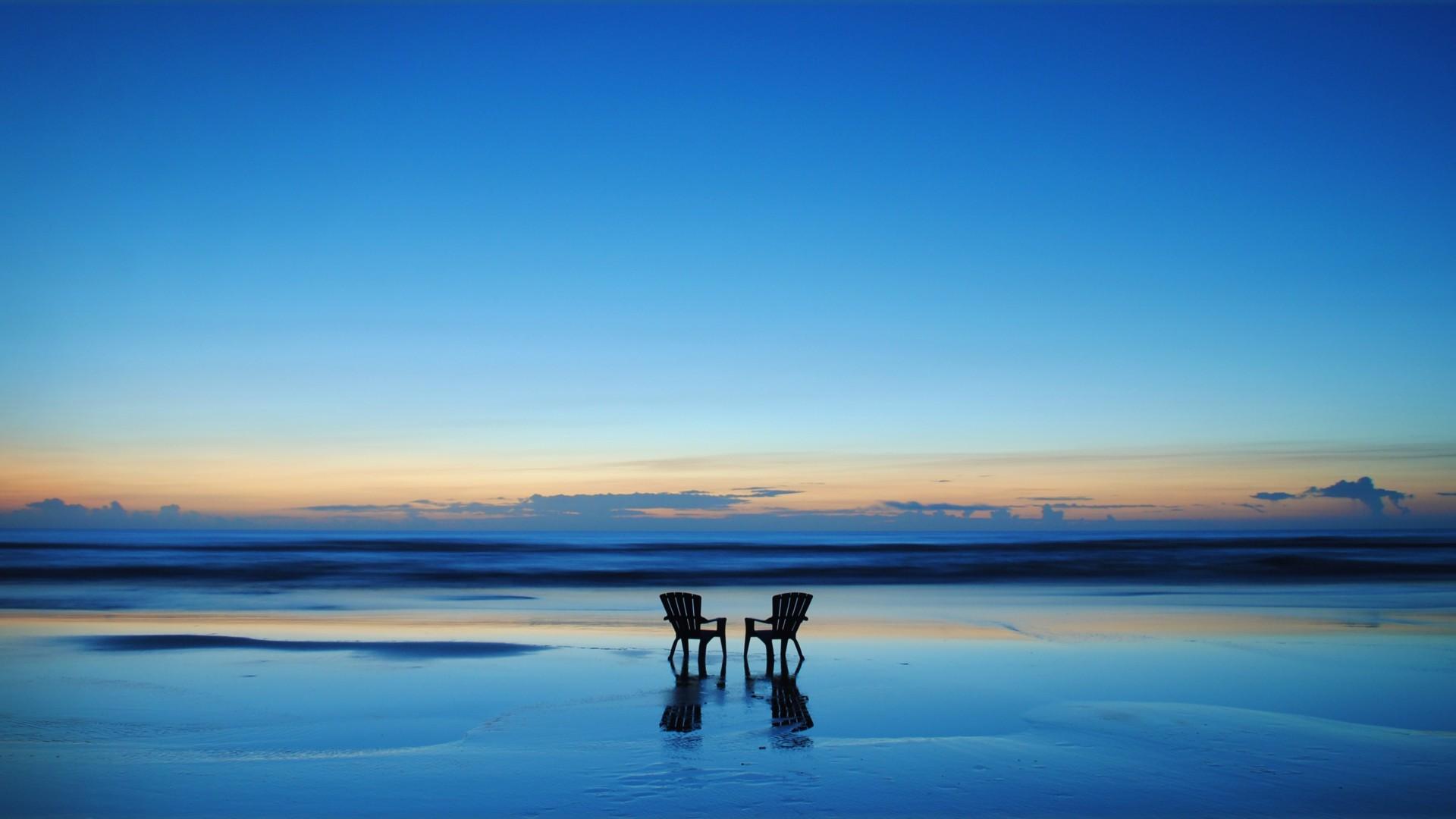 Two Empty Chairs on The Beach