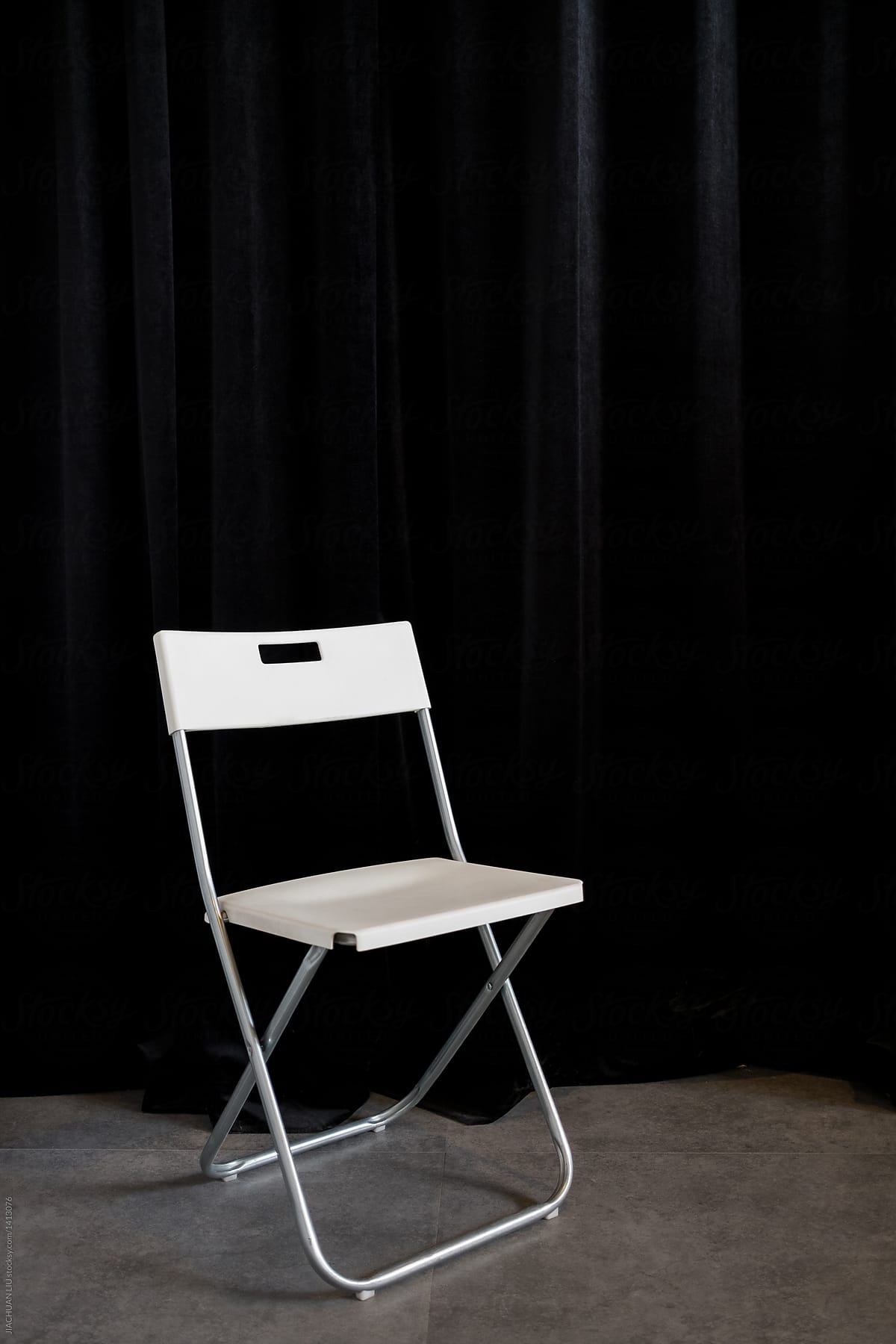 Empty chair on stage