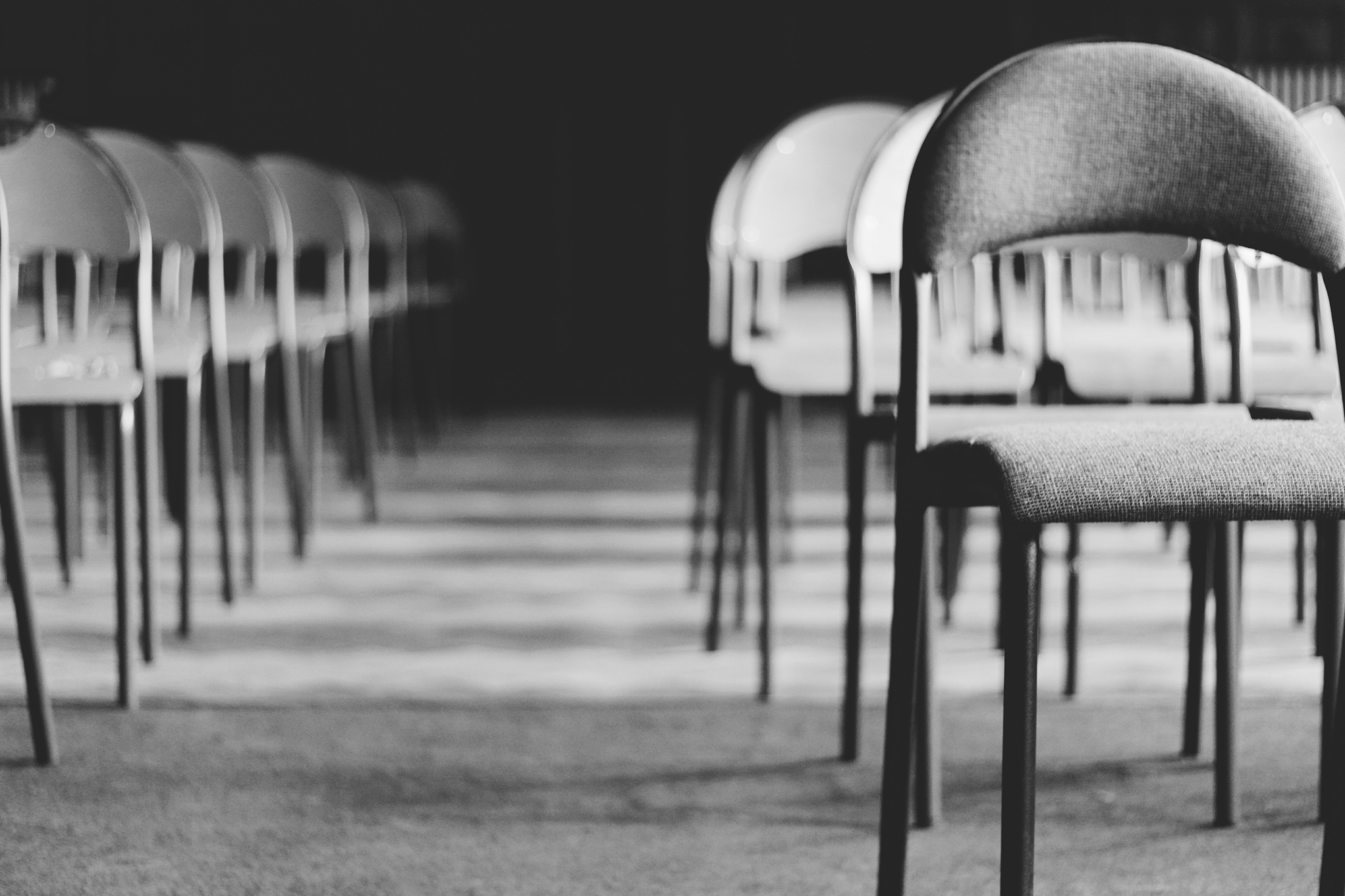Grayscale Photo of Empty Folding Chairs · Free