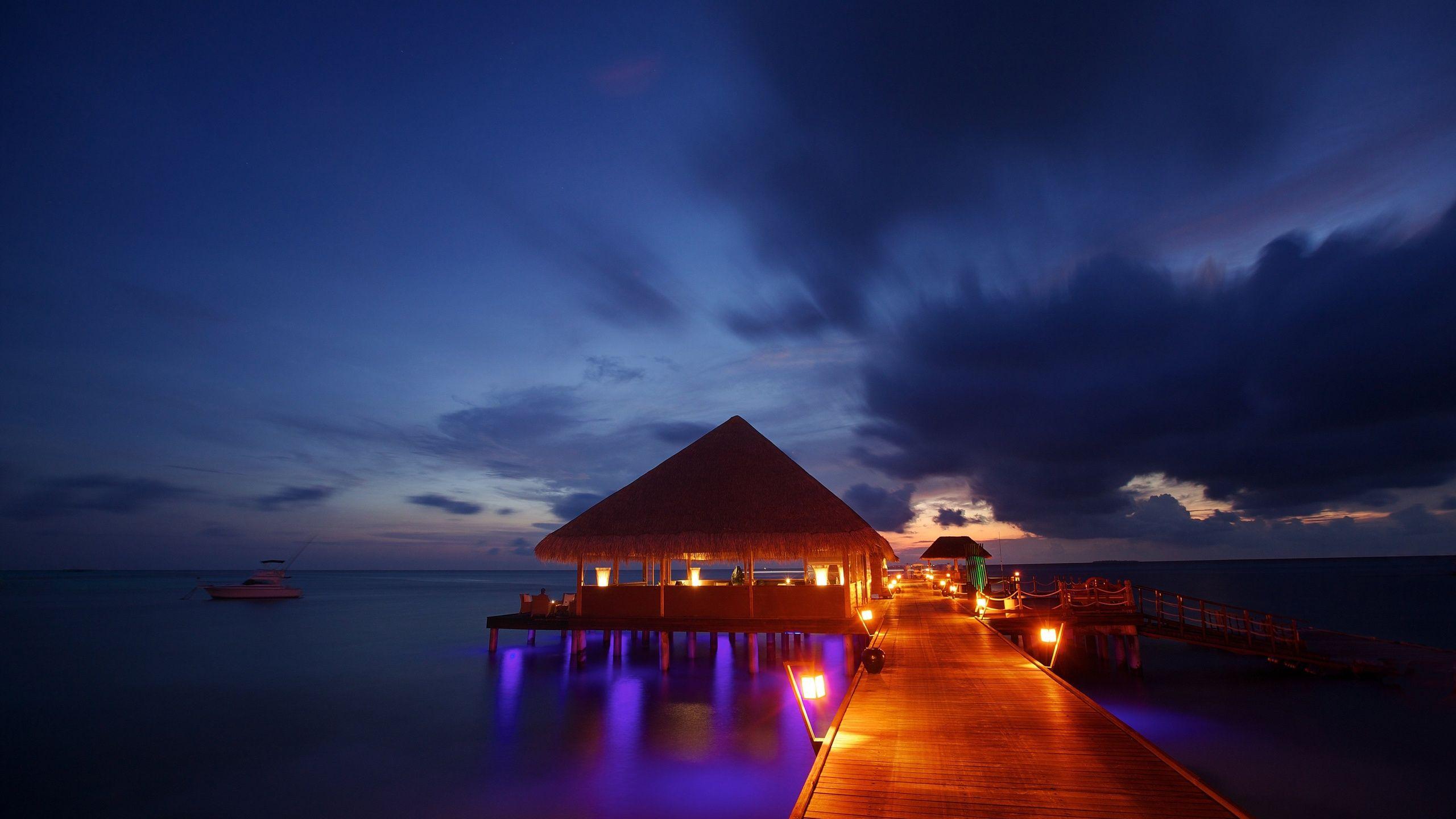 night lights Maldives tropical beach bungalow ocean sea sunset