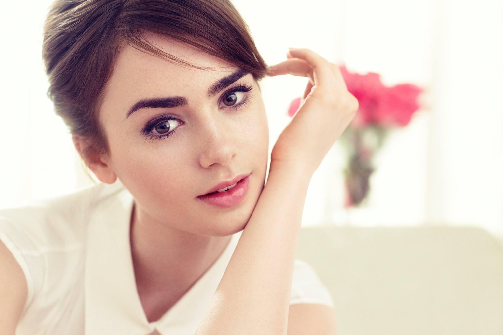 women lily collins brunette looking at viewer face hand