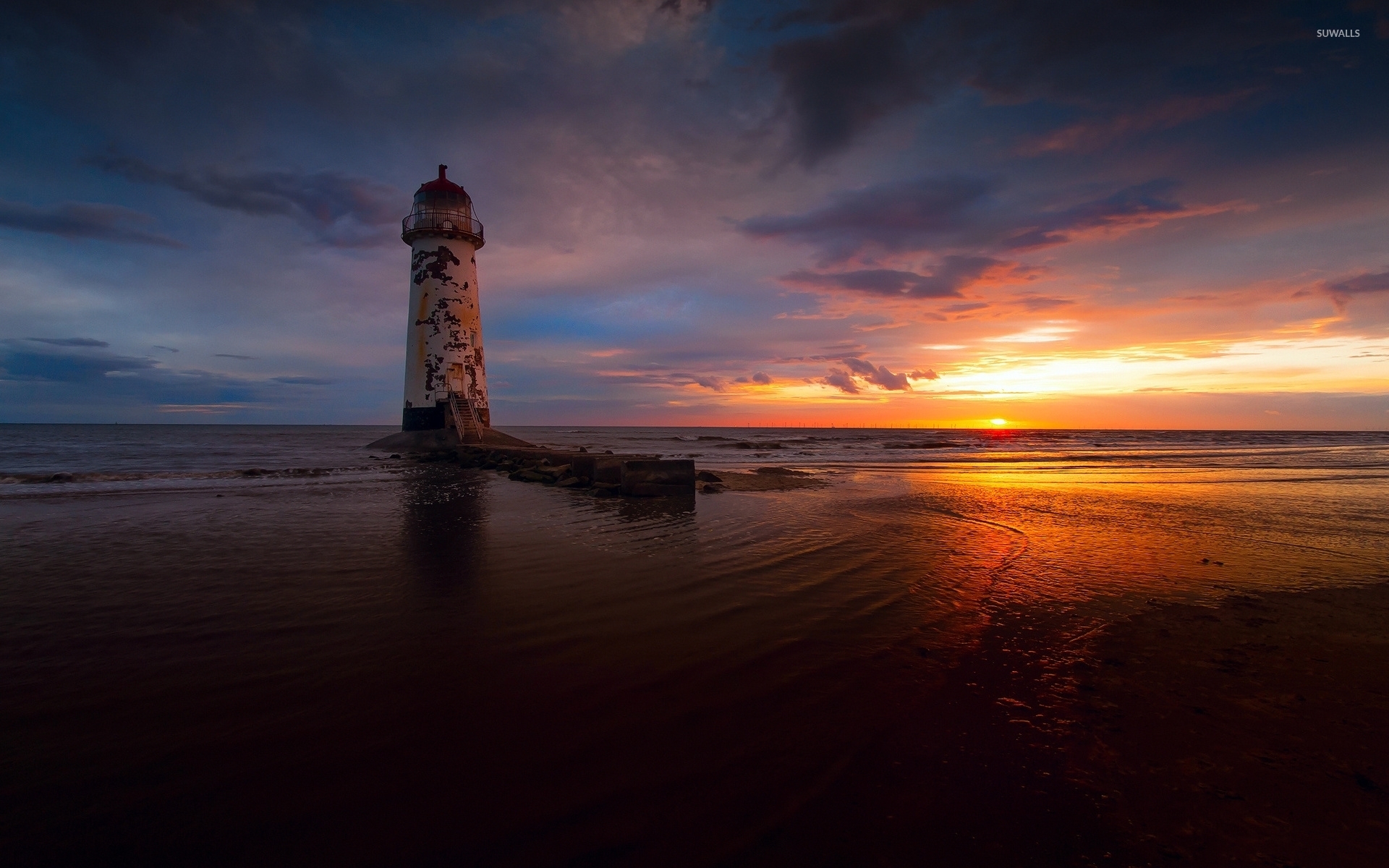 Abandoned lighthouse with a great view of the ocean sunset wallpaper