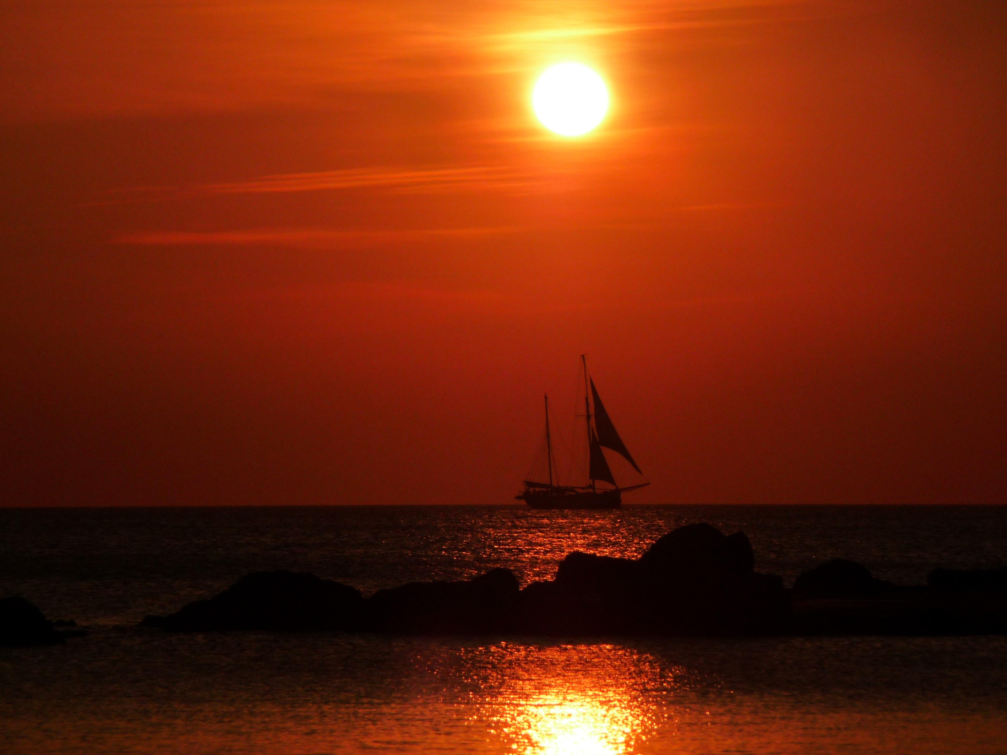 Sailboat on the Ocean during Sunset · Free