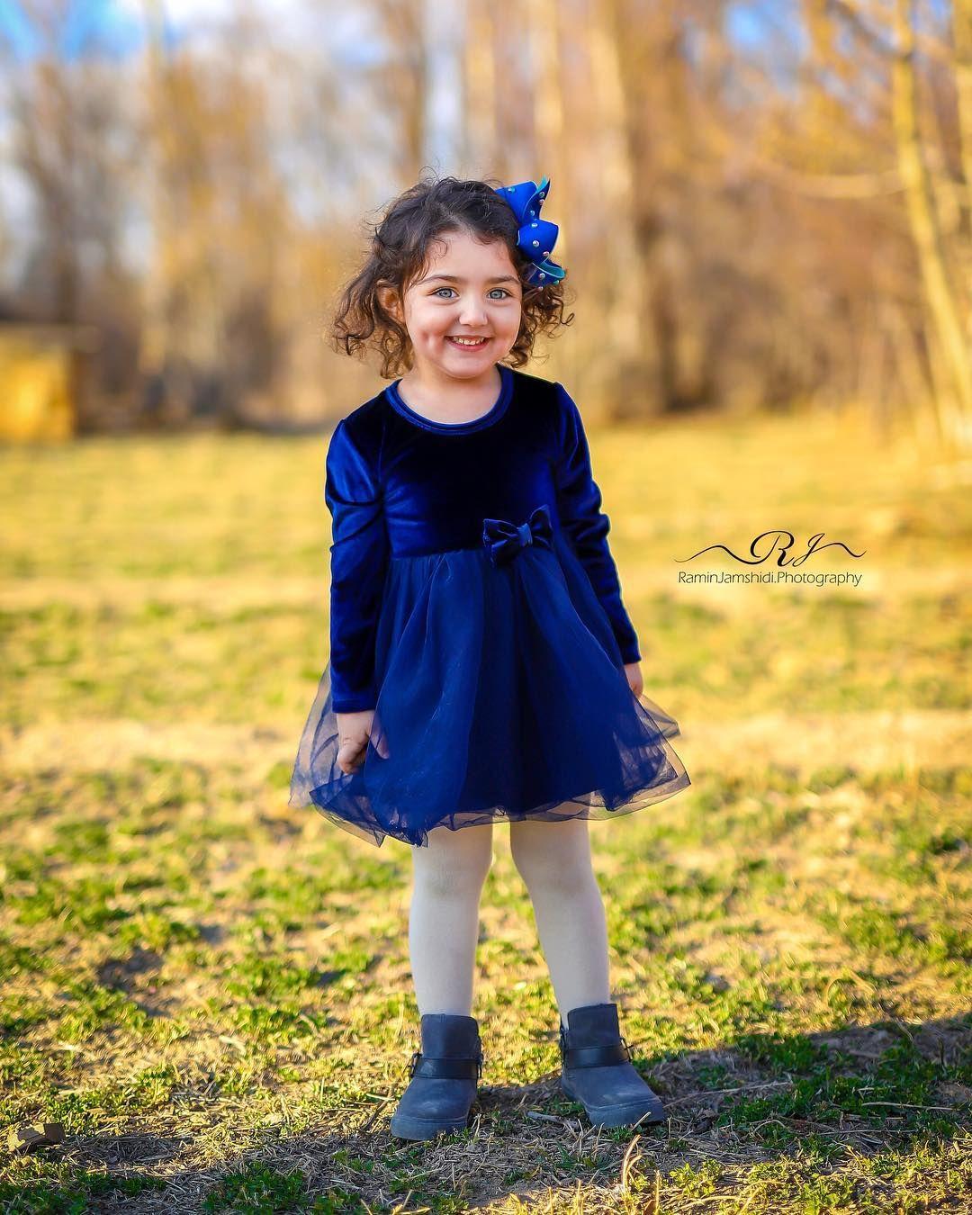 Image may contain: 1 person, standing, child, shoes and outdoor