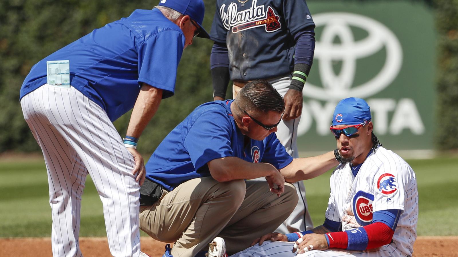 Javy Baez escapes serious injury after taking knee to head