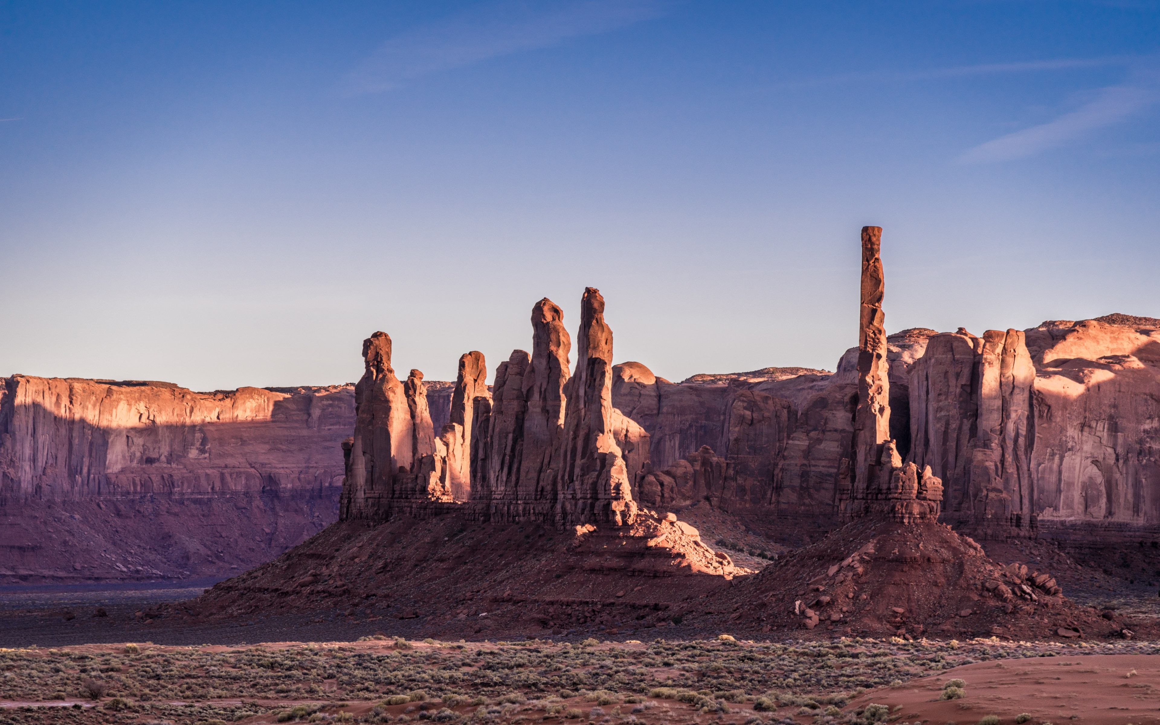 totem poles at golden hour 4k wallpaper and background