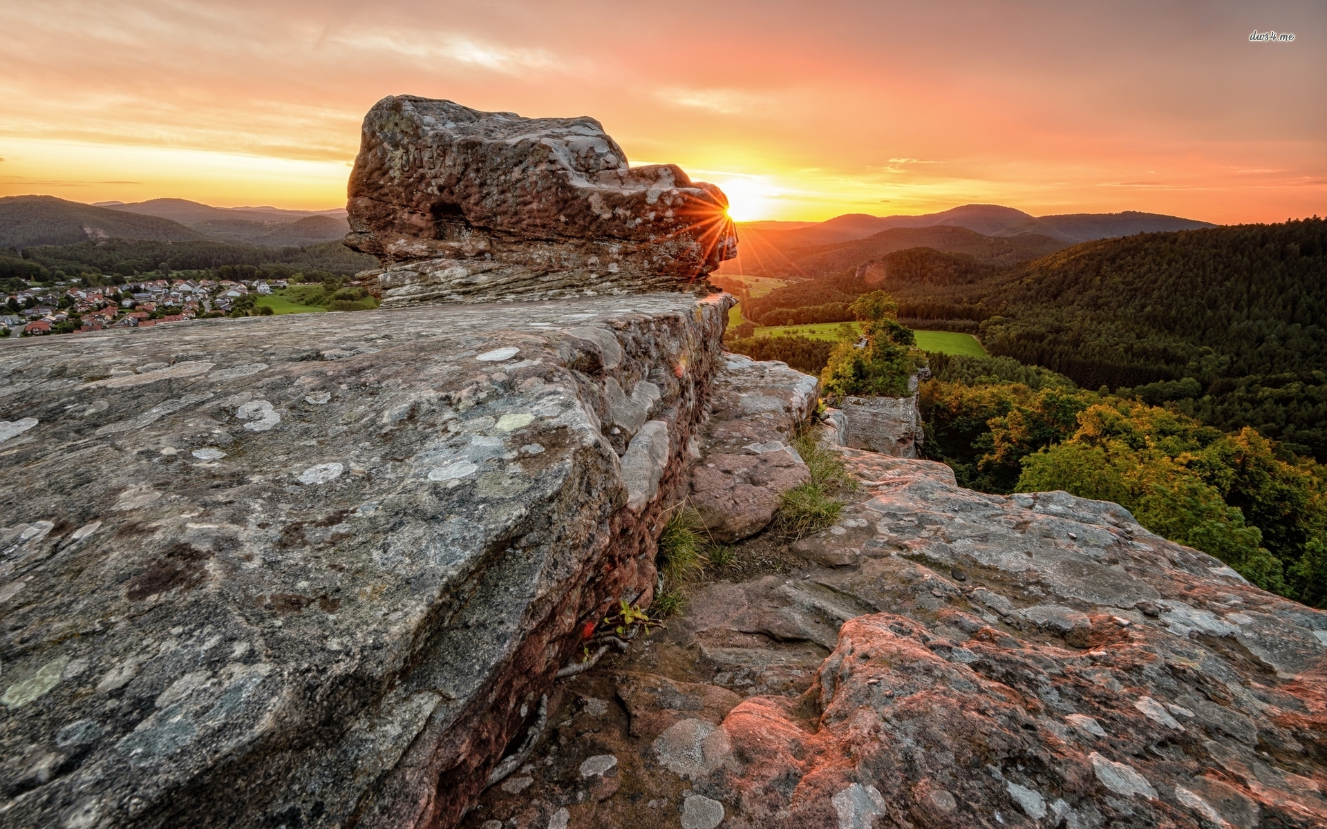 Rock on top of the rocky mountain rising toward the sky wallpaper