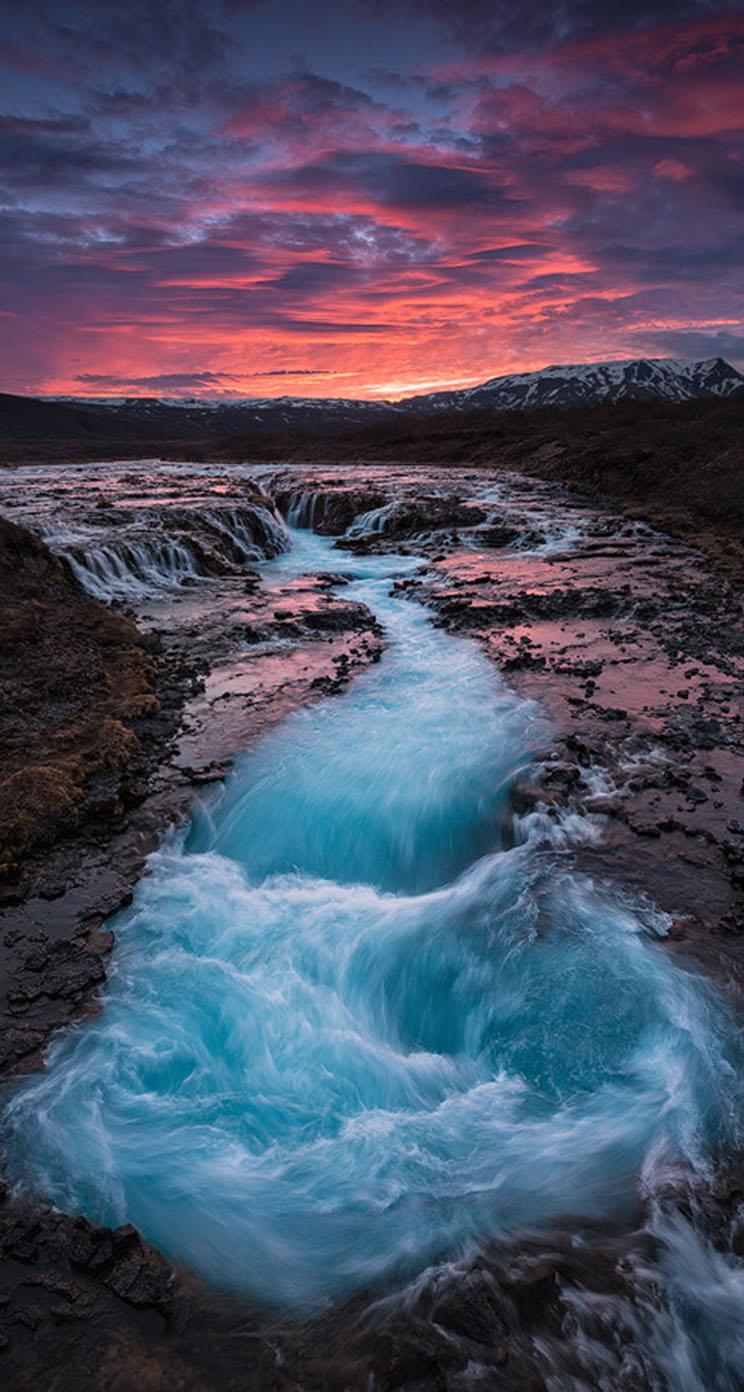 The iPhone Wallpaper Sunset at the waterfall Brúarfoss
