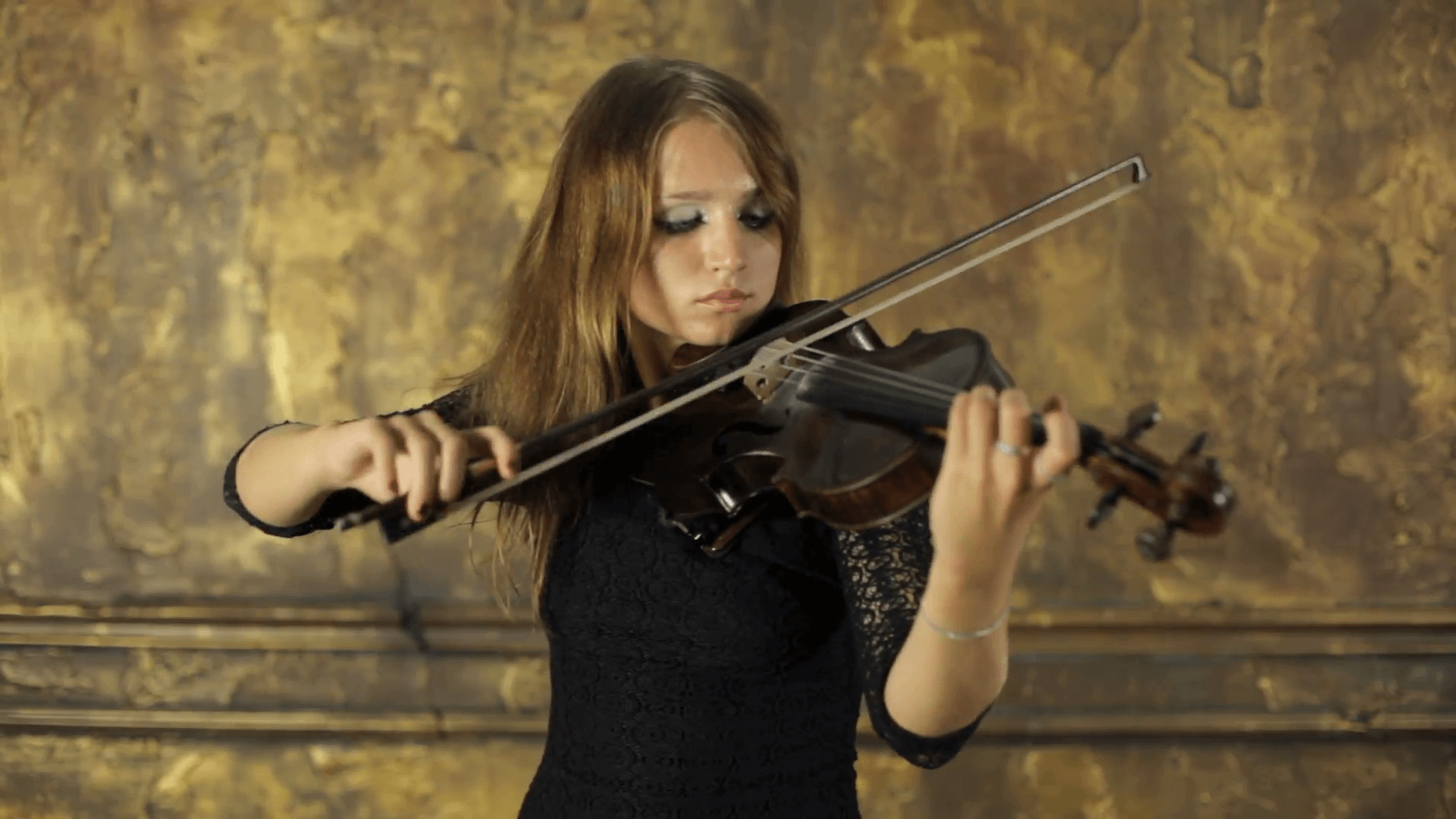 Girl playing violin on vintage background Stock Video Footage