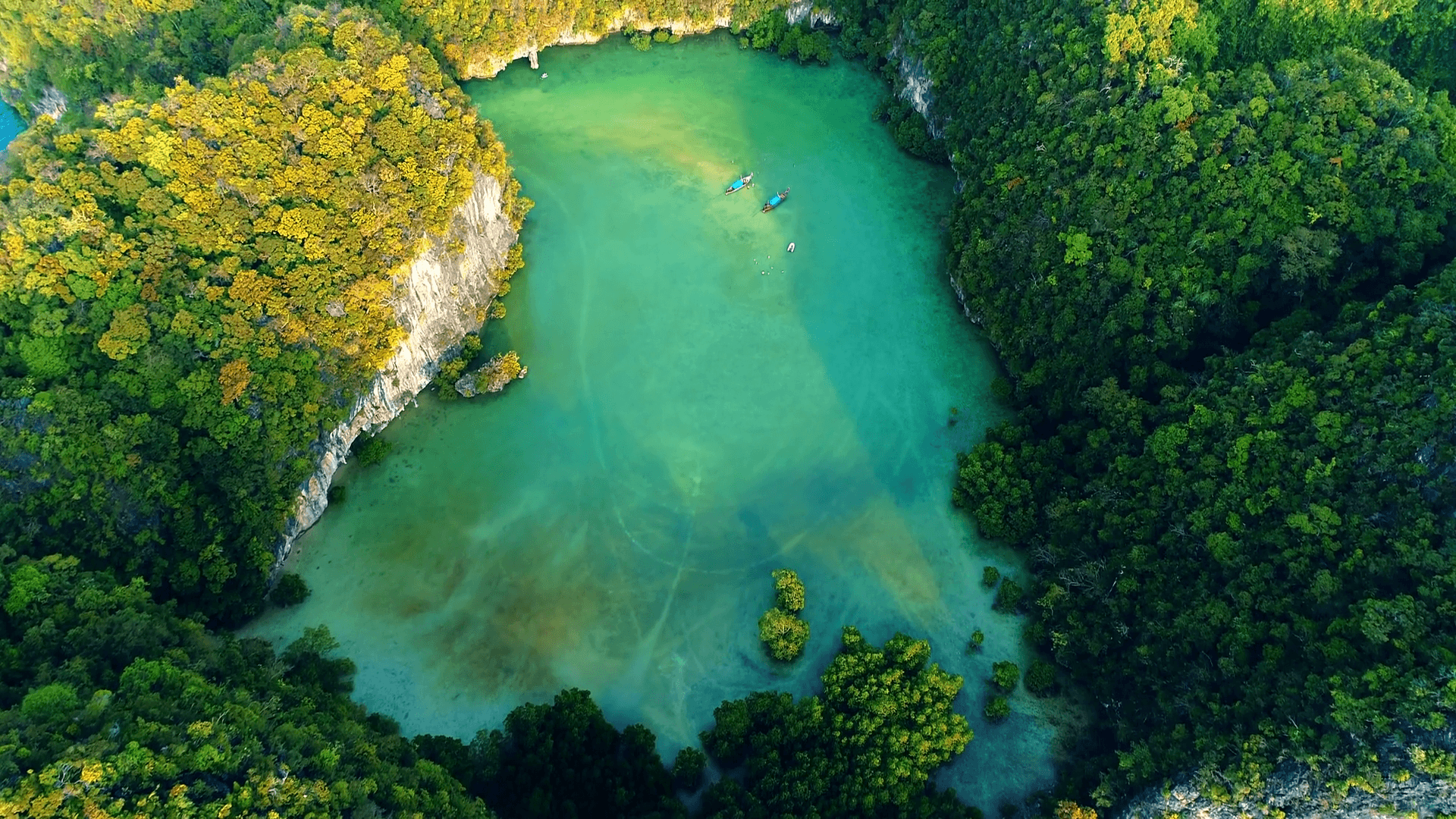 Aerial top view of turquoise lagoon in heart shape Love inside