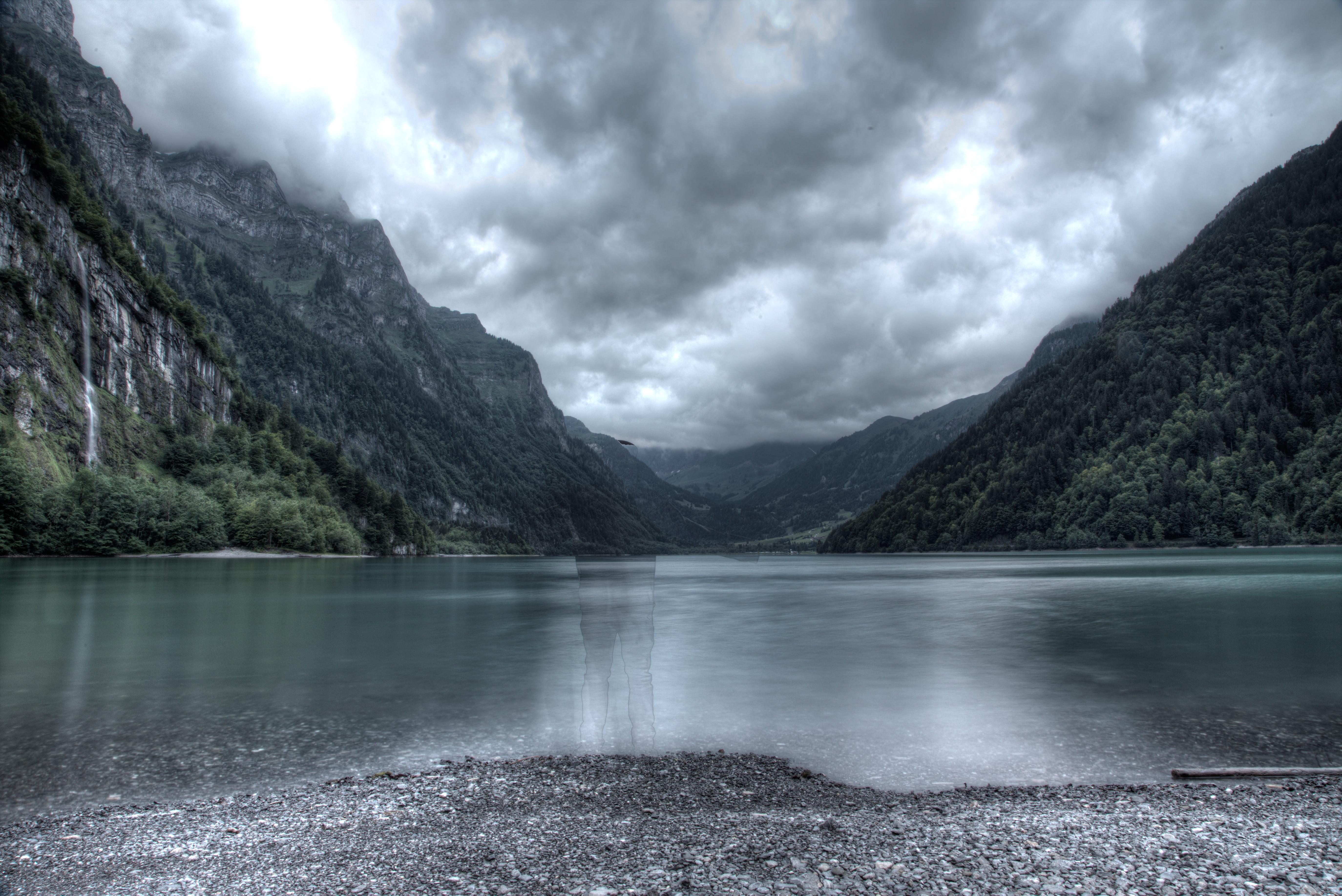 Lake between the mountain during cloudy day HD wallpaper. Wallpaper