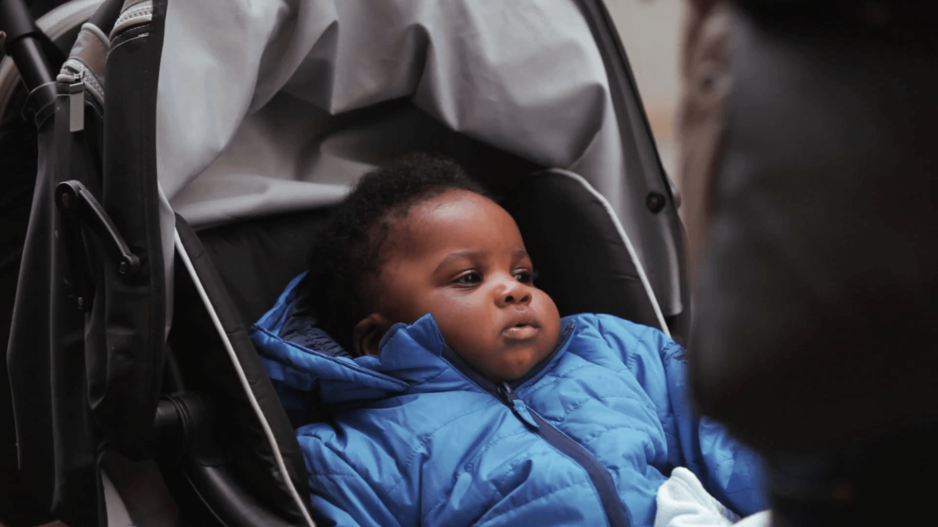 A cute black boy in his baby carriage Stock Video Footage