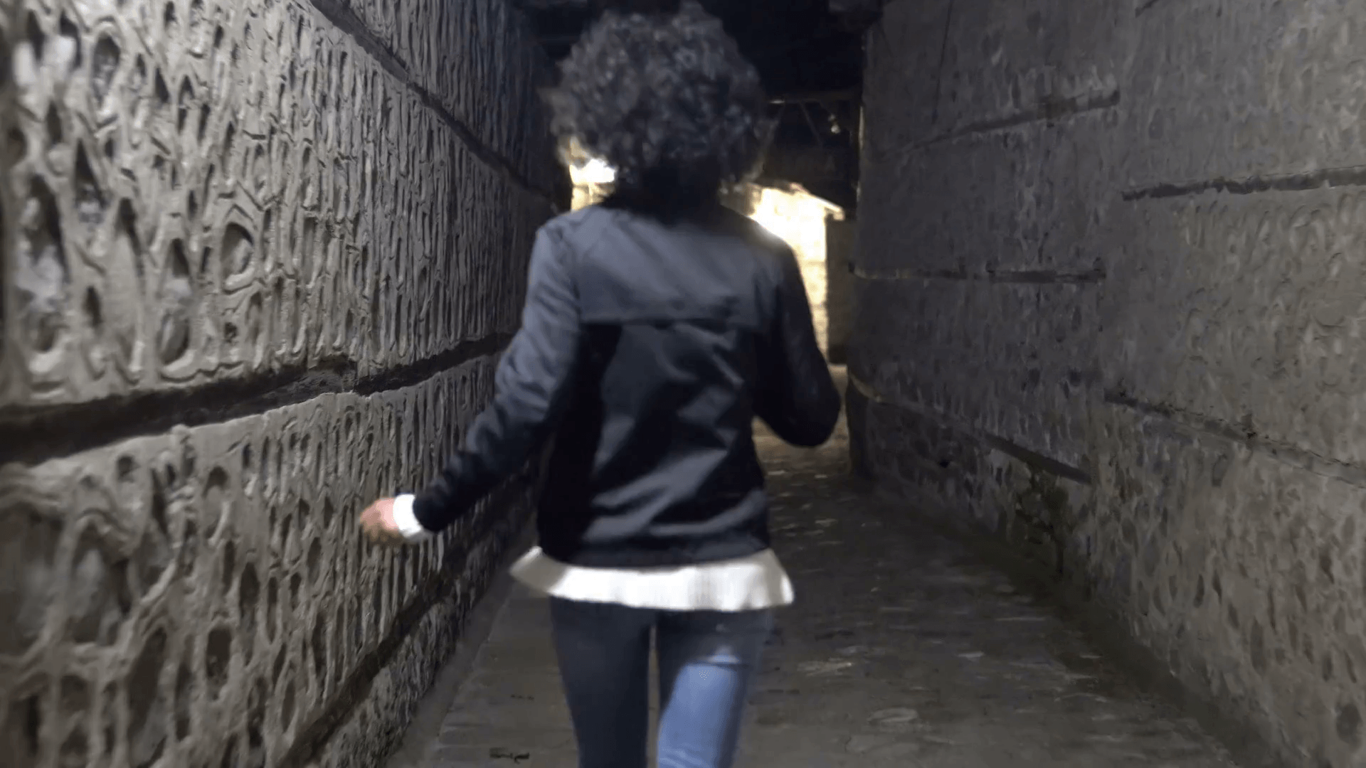 Chasing a Woman Running Away in Old street Alley at night Stock Video Footage