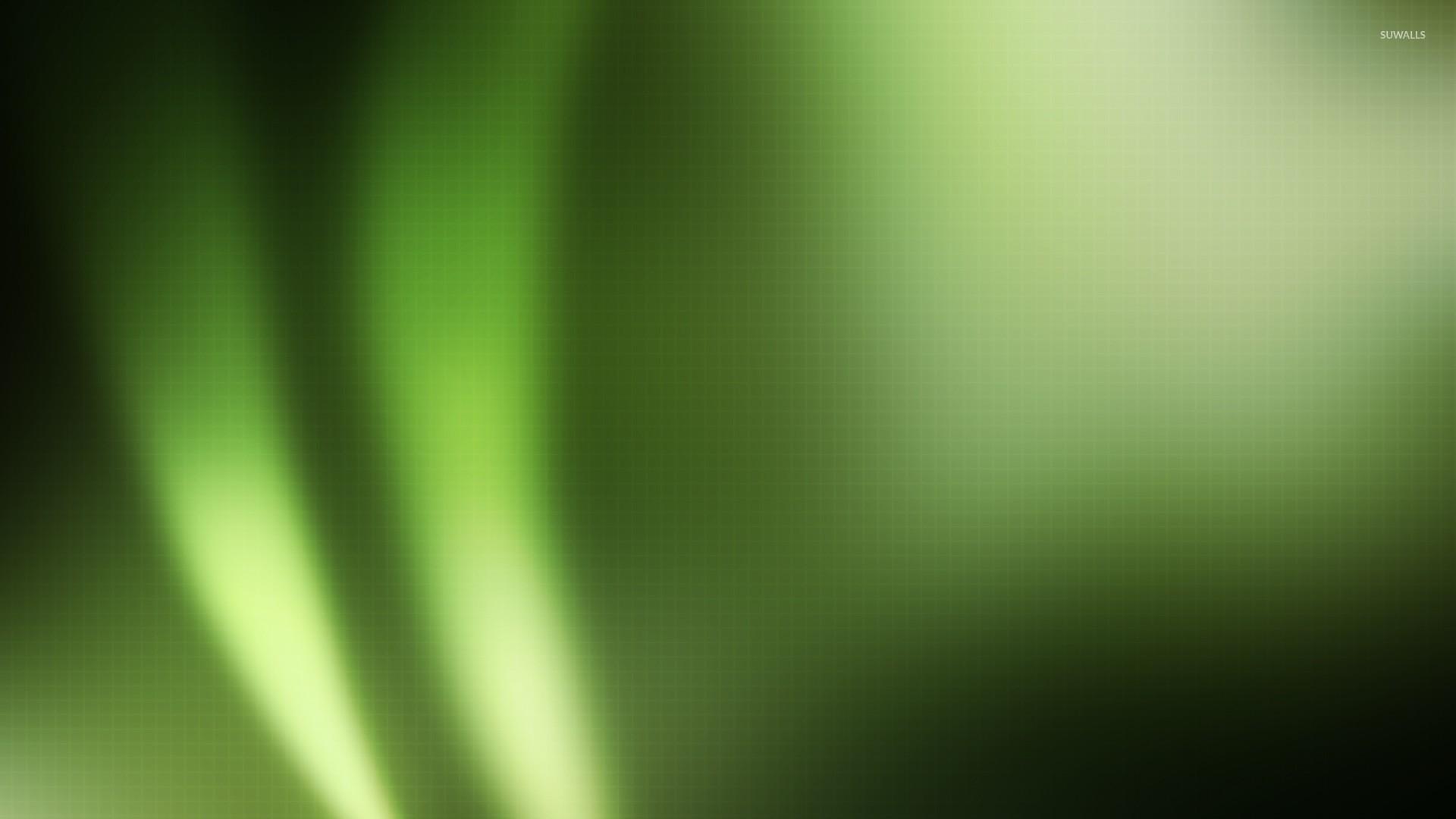 Light flares on green square pattern wallpapers