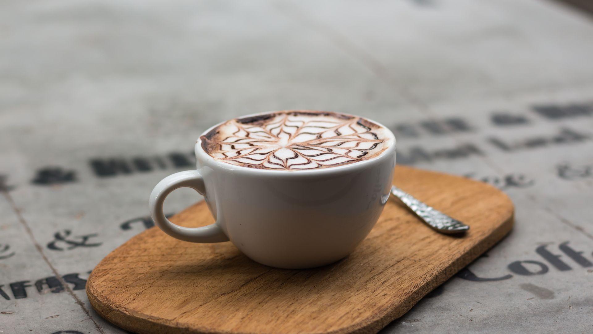 Cappuccino in Ceramic Teacup Wallpaper