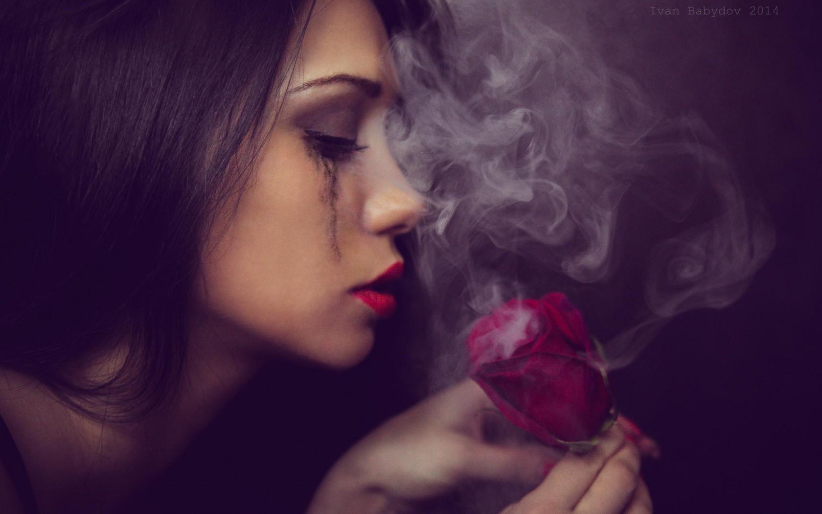The girl looks at smoking rose wallpaper and image