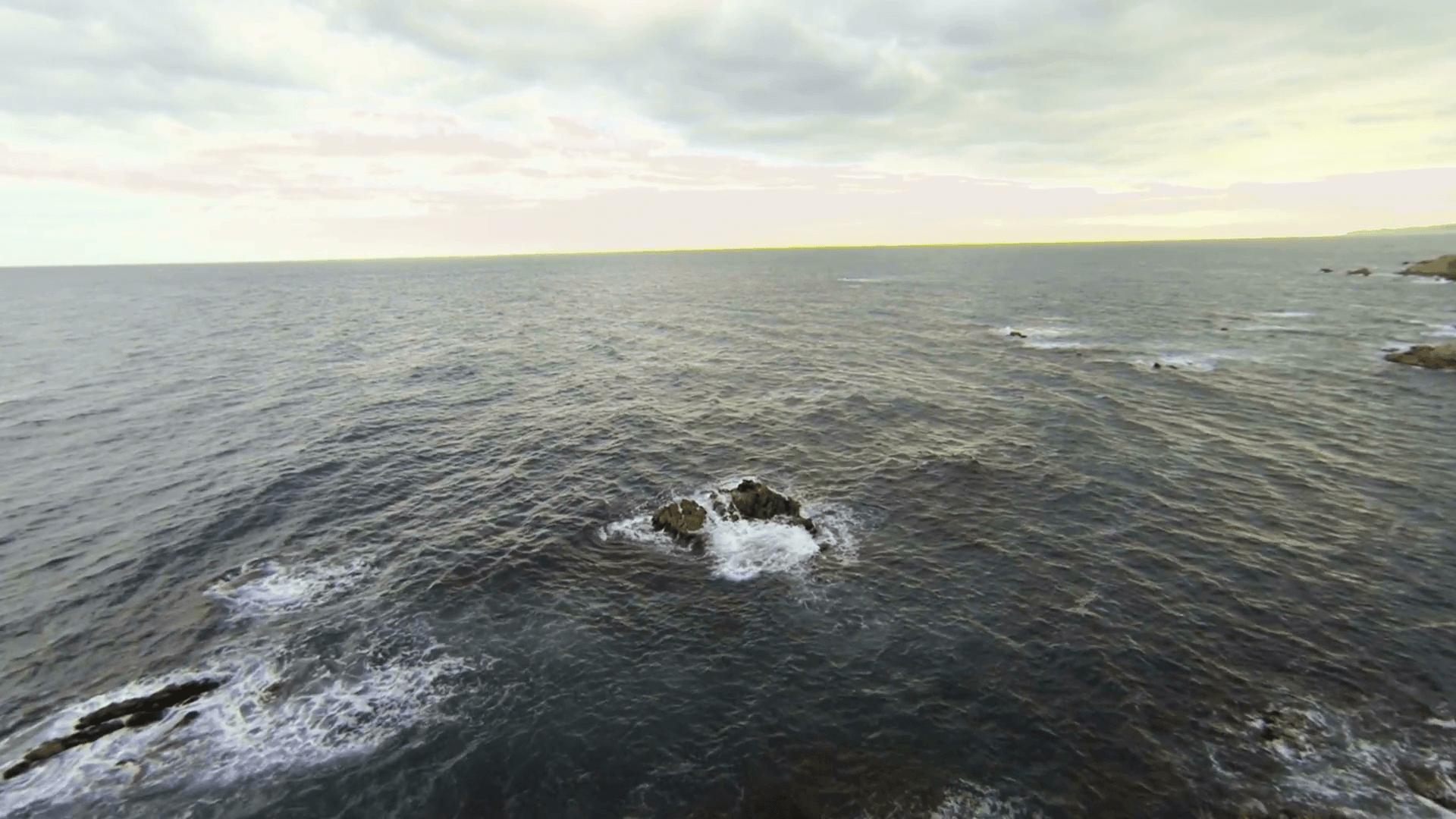 Aerial Shoot Drone View Mediterranean Beach Aerial video shot in a typical Mediterranean beach. Moving along the seashore over Stones, trees and sand