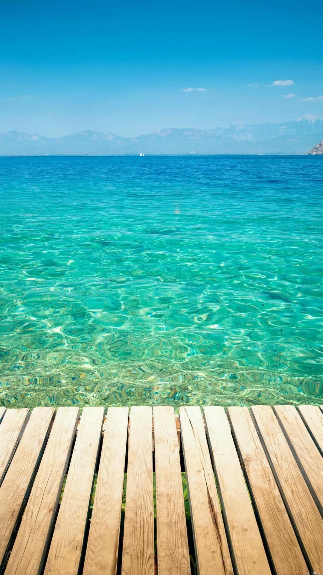 Wooden Dock Transparent Sea Water android wallpaper