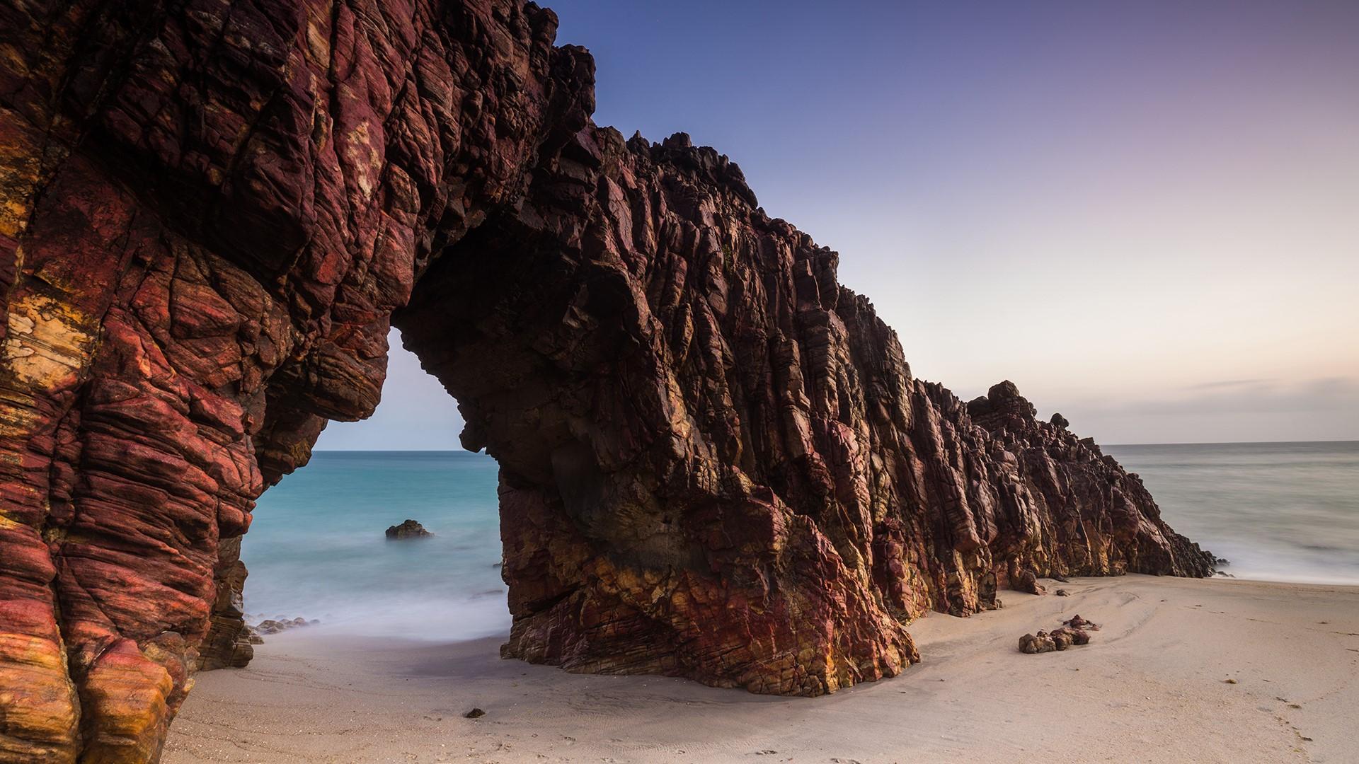 Pedra Furada rock formation on Jericoacoara beach, Brazil. Windows