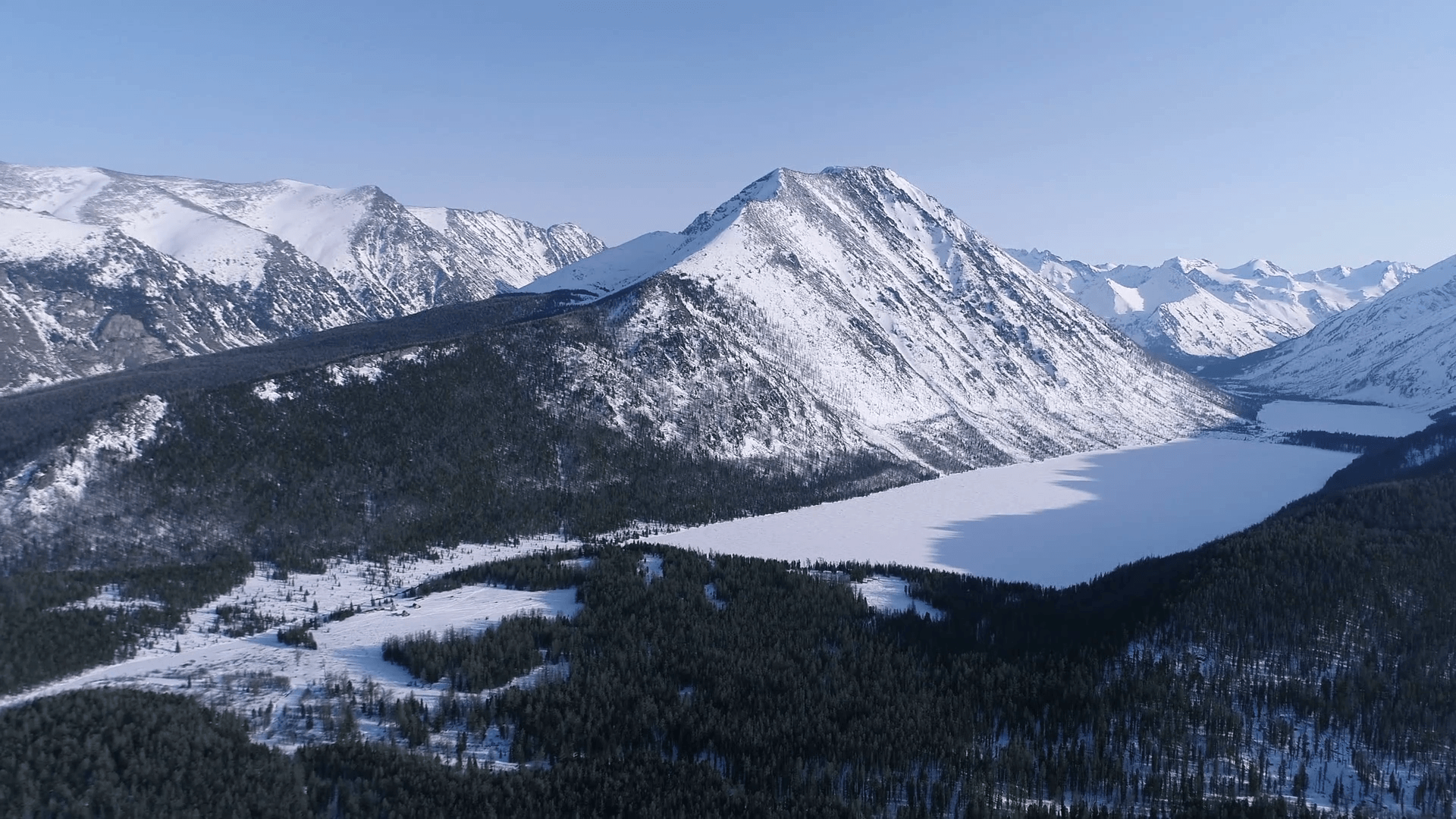 Aerial Snowy Peaks at sunset in Altai Mountains Stock Video Footage