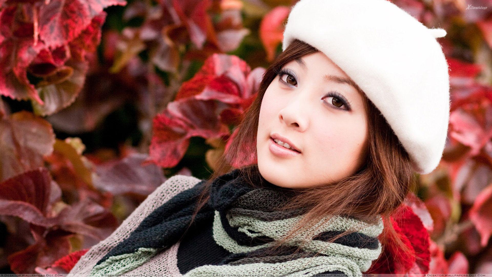 Beautiful Asian Girl Face Closeup in White Cap Wallpaper
