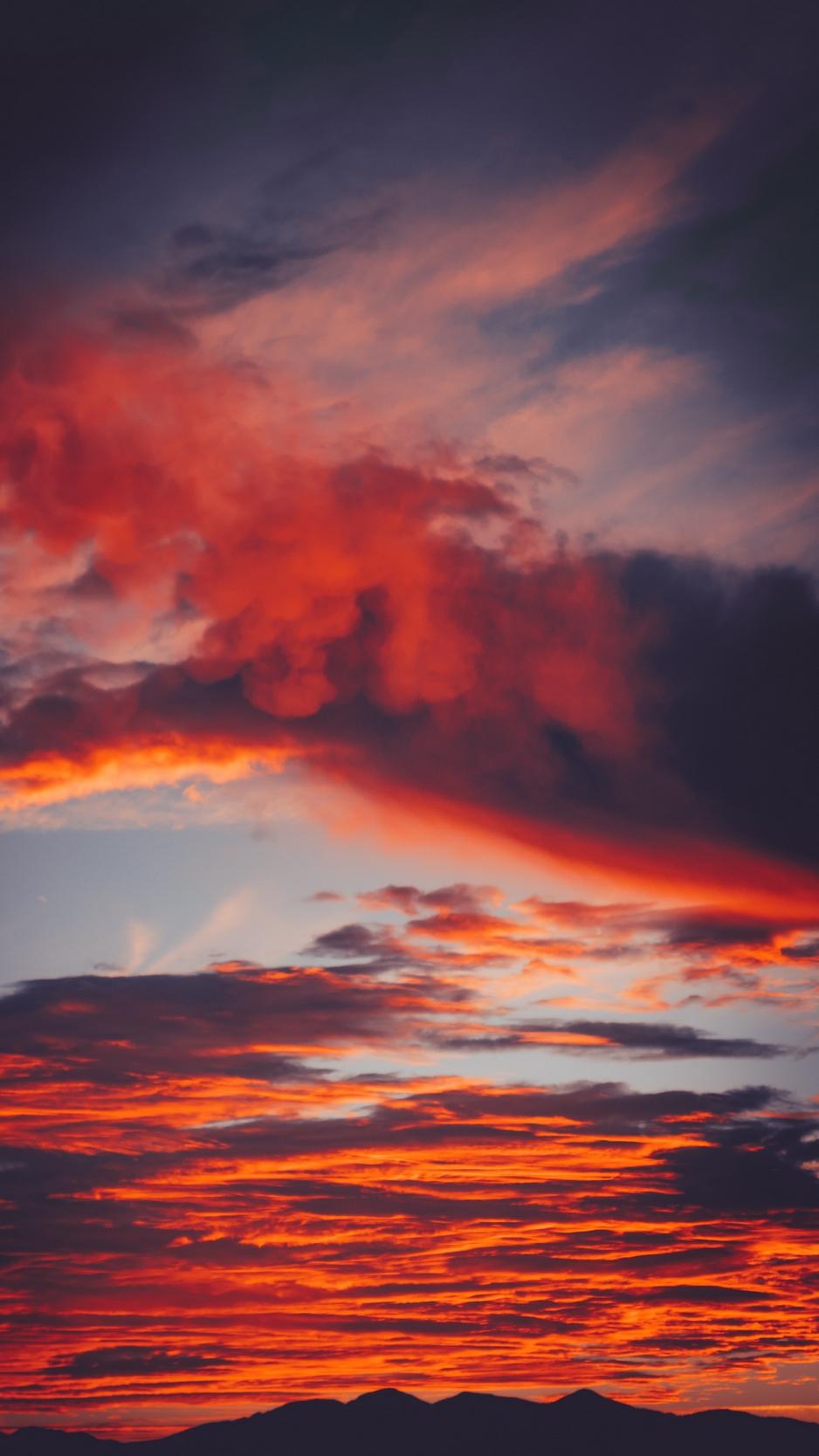 Download wallpaper 938x1668 clouds, sky, sunset, red, porous
