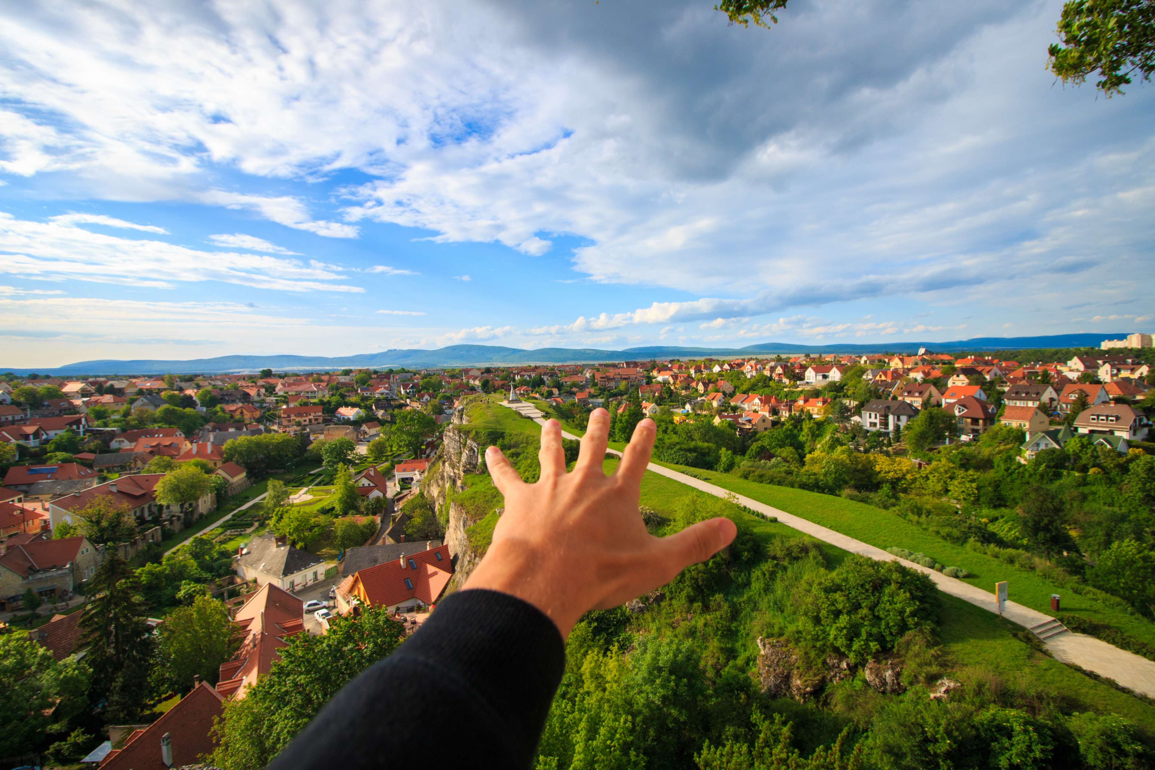 architecture, city, clouds, countryside, grass, green, hand