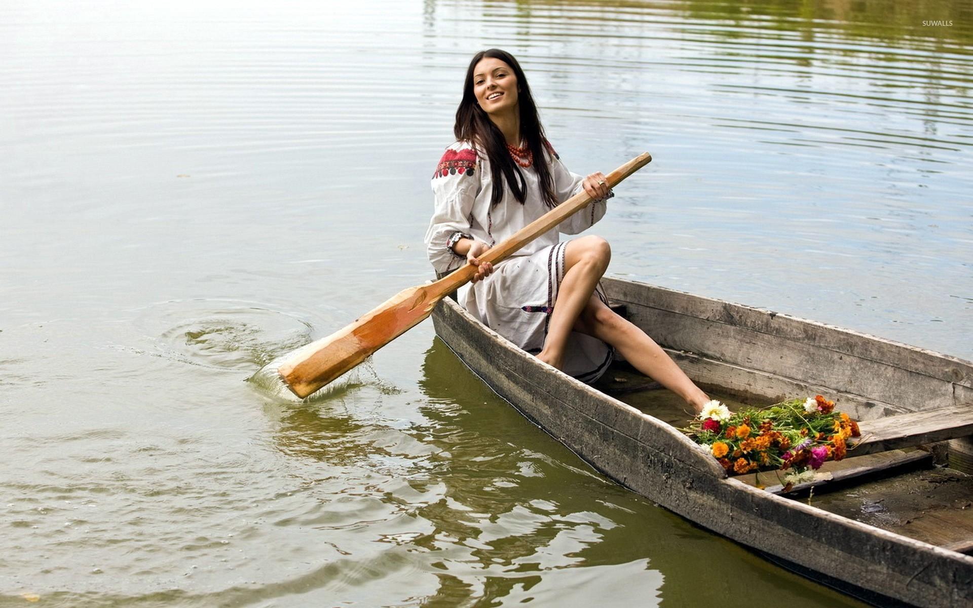 Beautiful woman on a boat wallpaper wallpaper