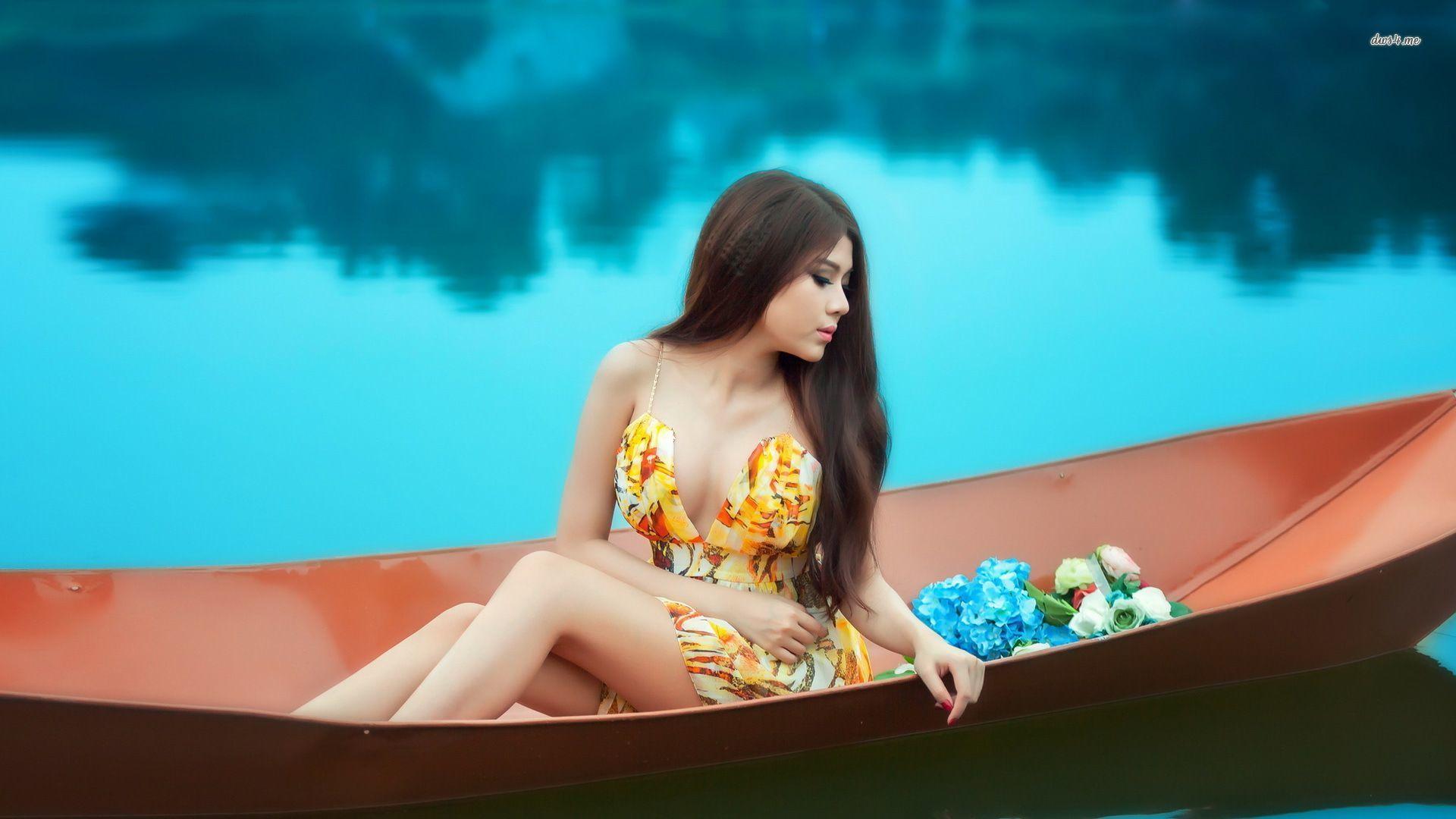 Superb woman sitting in the boat wallpaper wallpaper