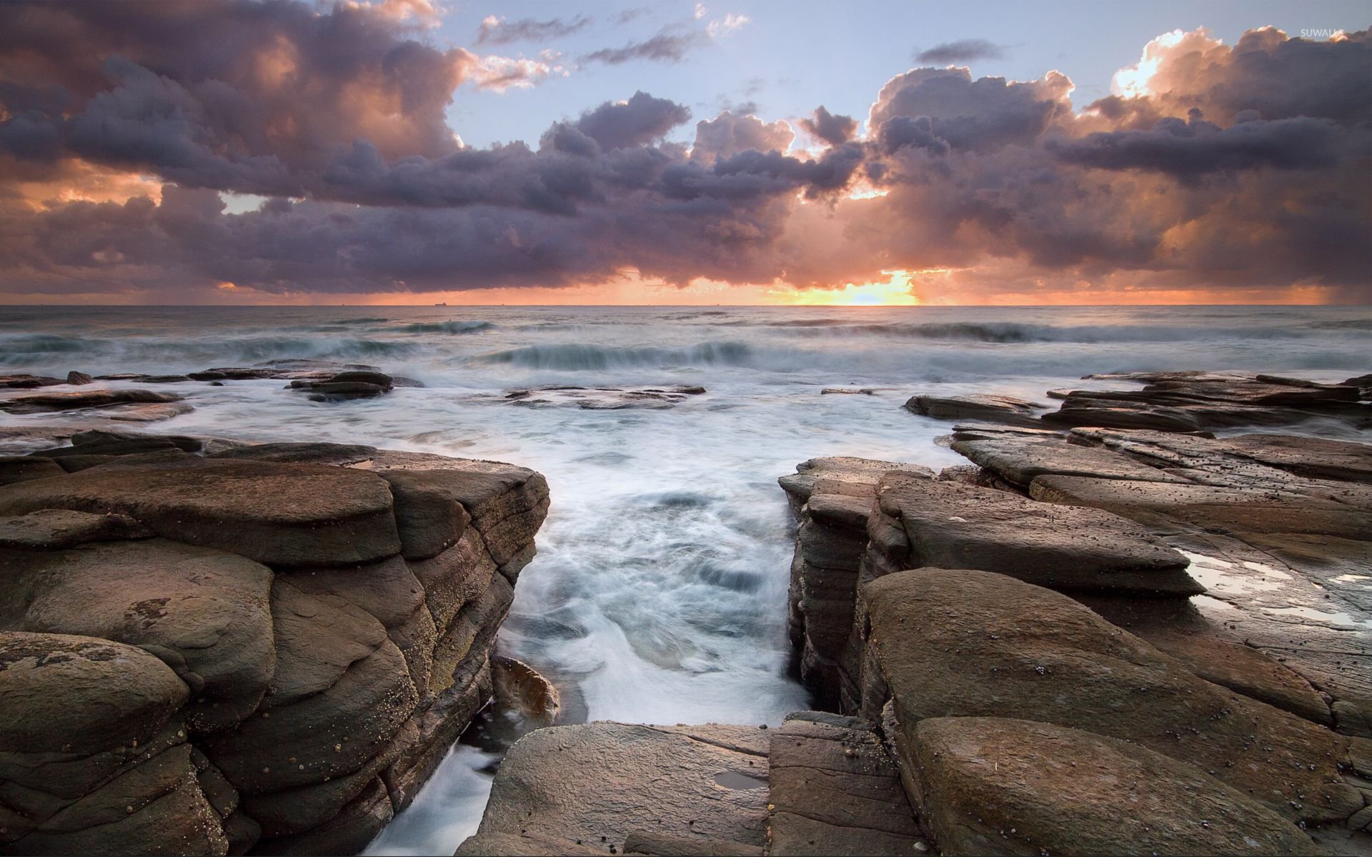 Waves rushing to the rocky shore wallpaper wallpaper