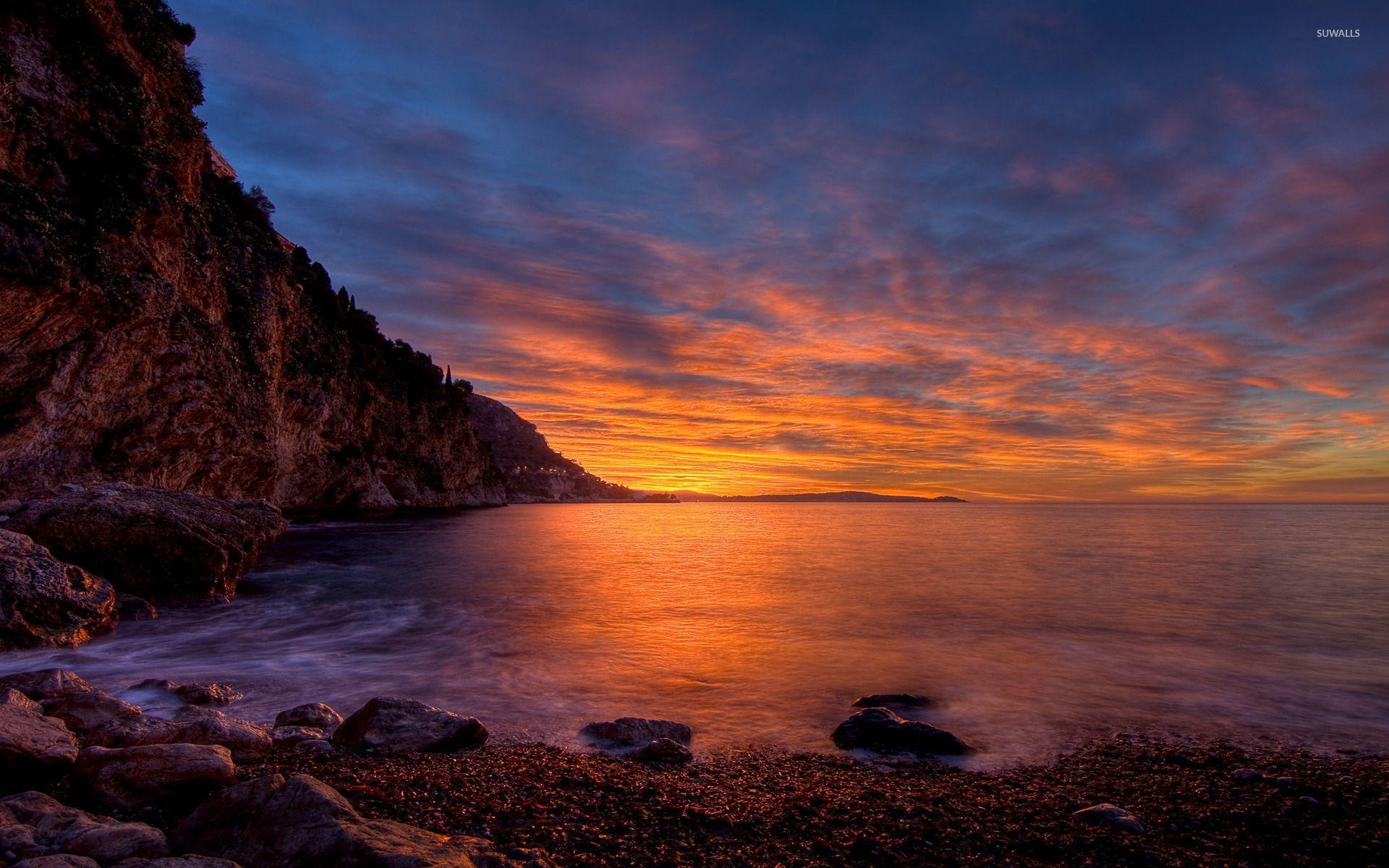 Beautiful sunset over the rocky shore wallpaper wallpaper