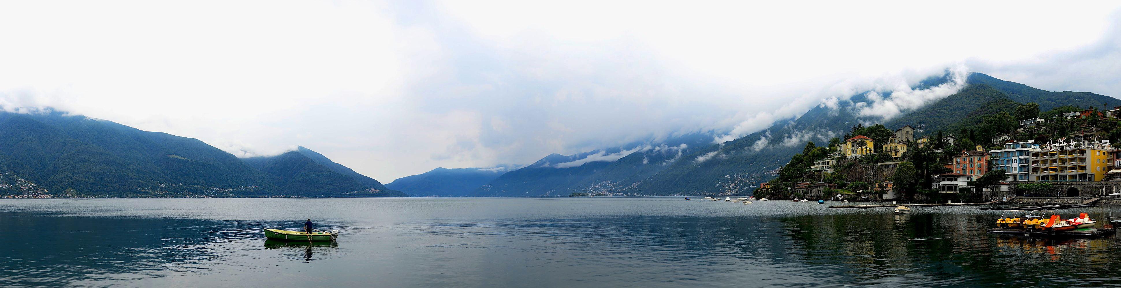 Panoramic photo of person riding on boat, lago maggiore HD wallpaper