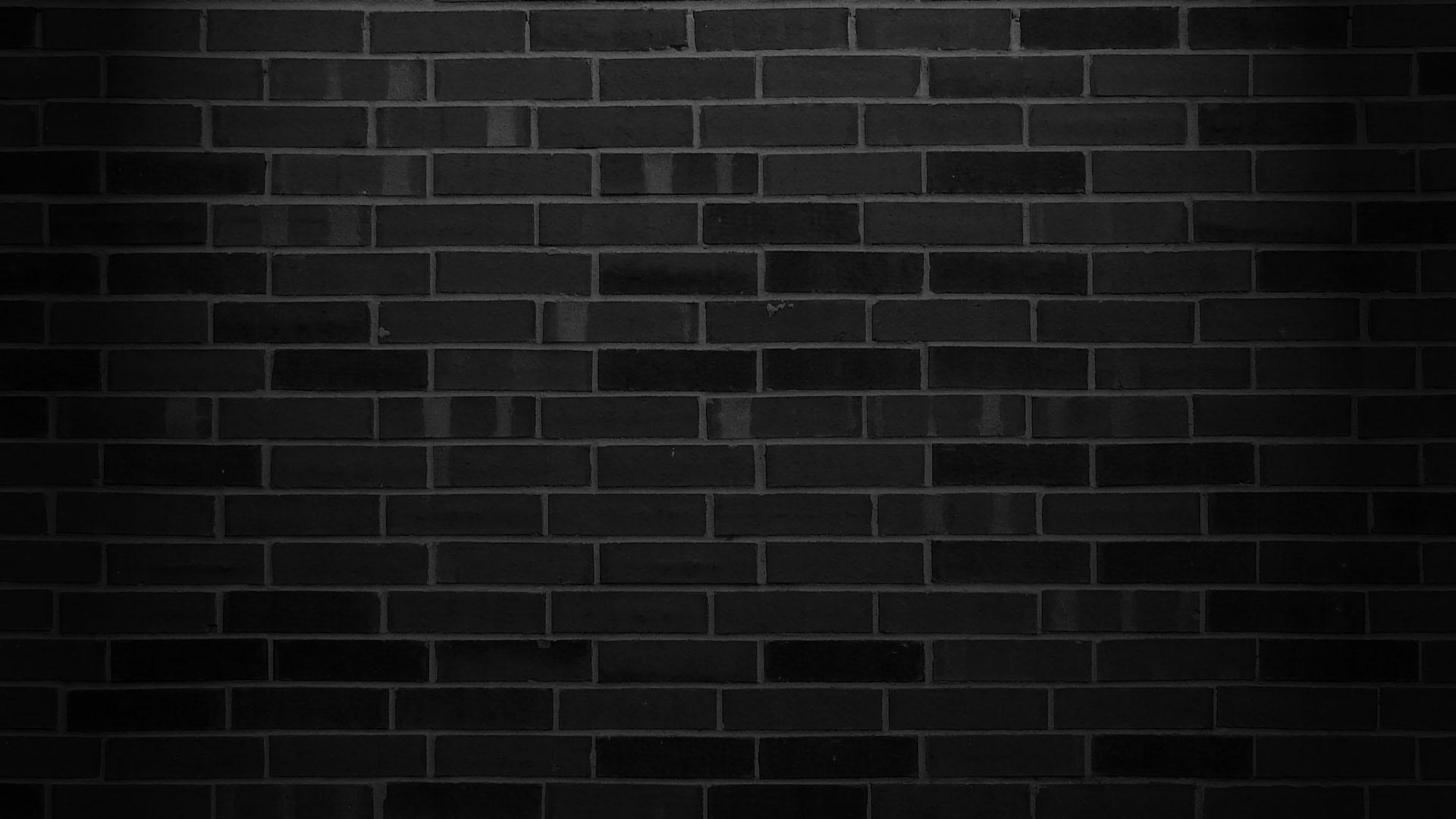 Grunge red abstract background with black bricks inside.