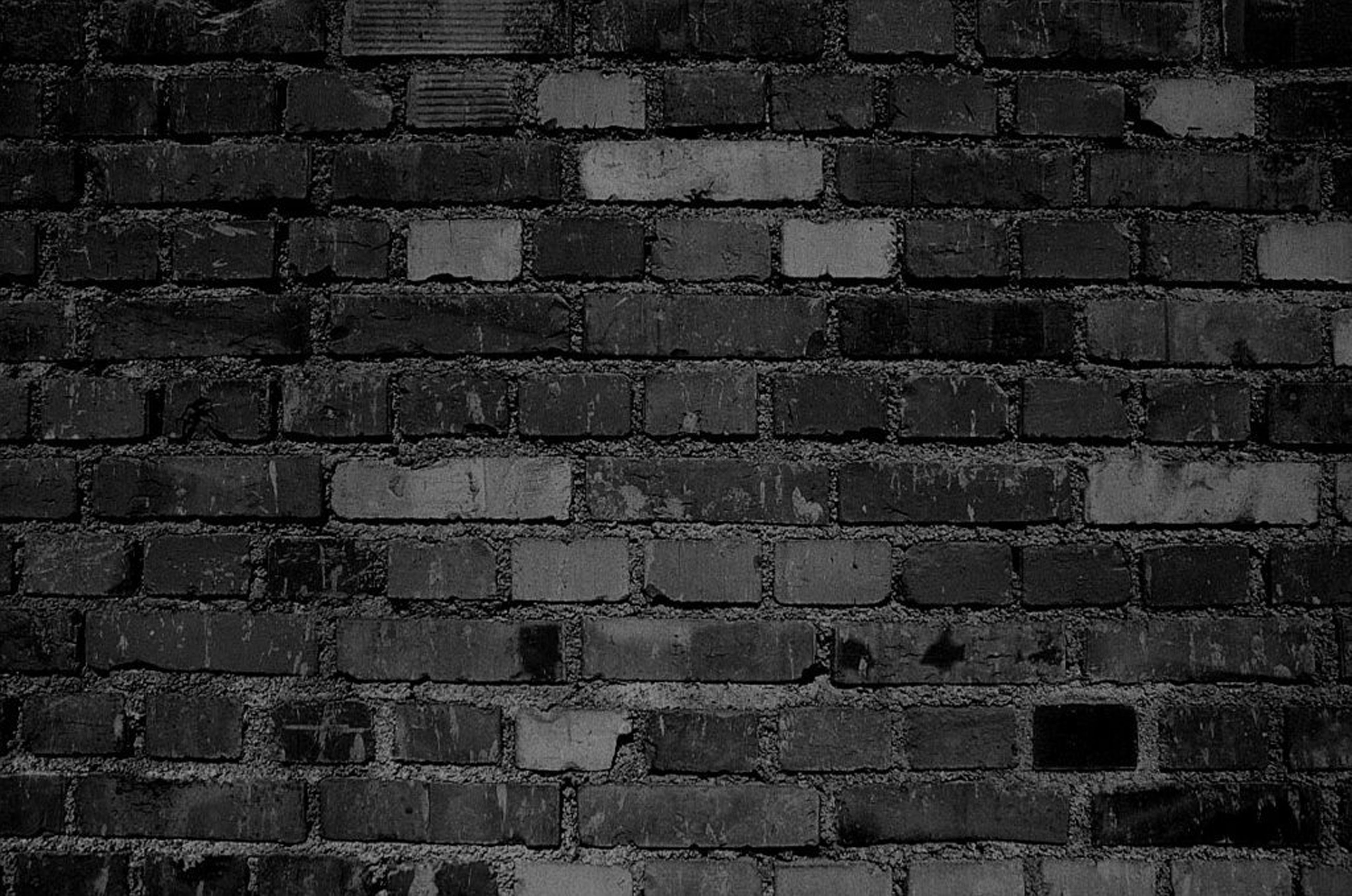 manu. Black brick wall, Textured brick
