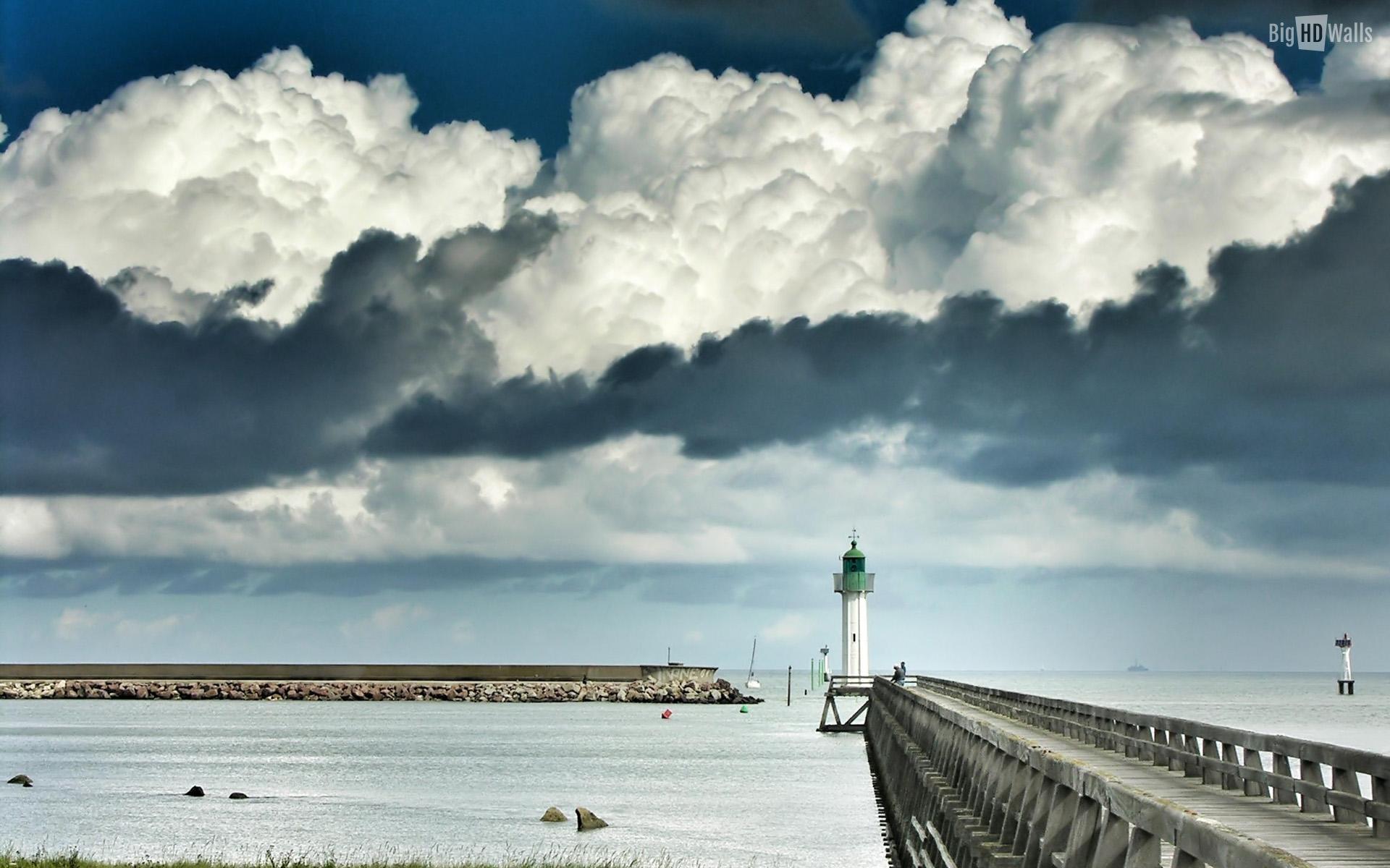 The lighthouse and the storm clouds HD Wallpaper