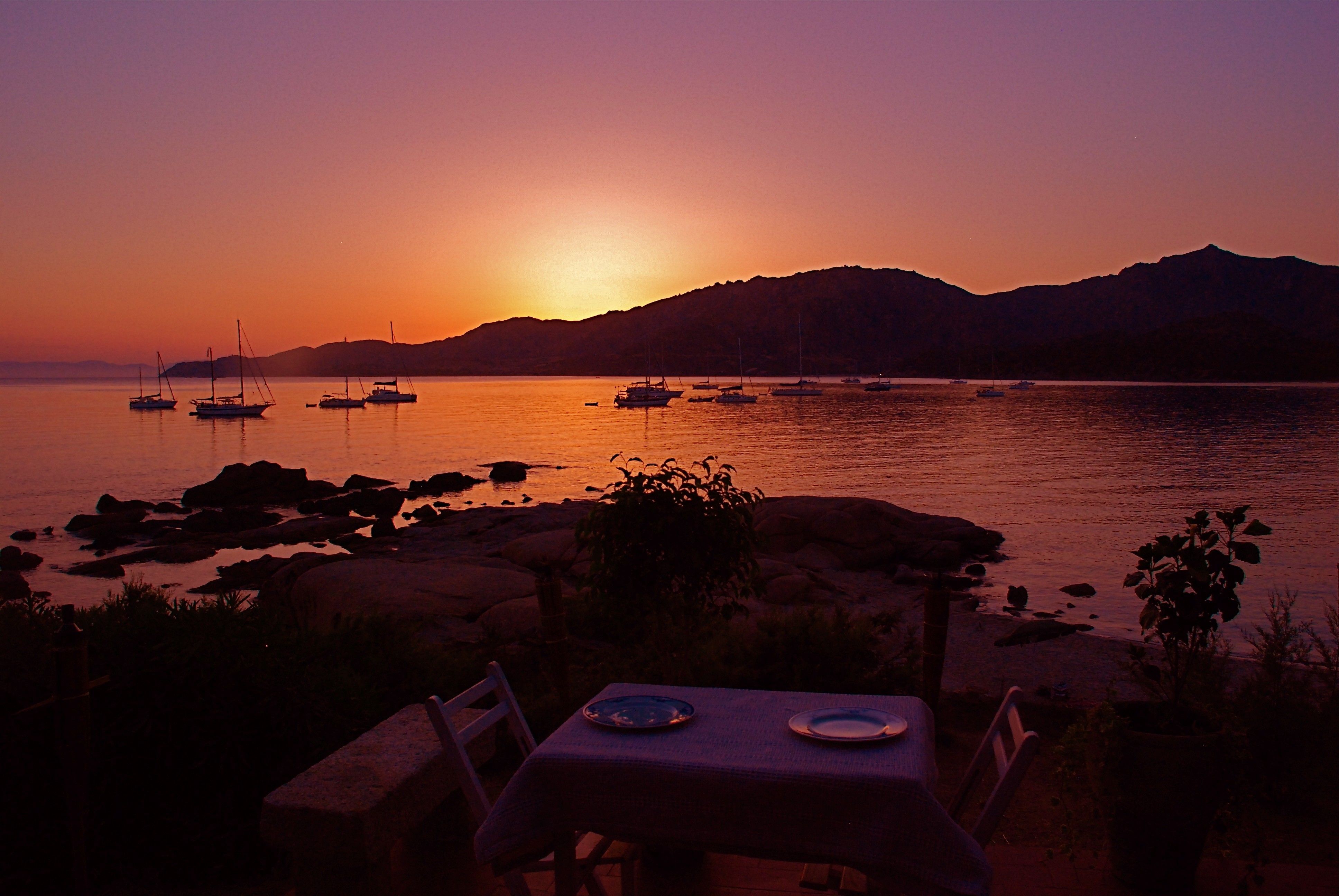 Sunset beach dining table for two wallpaper